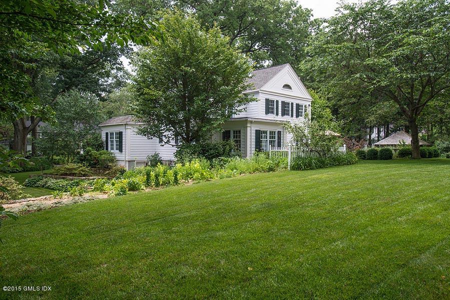 15 Owenoke Way Riverside, CT 06878 - Photo 17 of 22 a front view of a house with a yard and trees