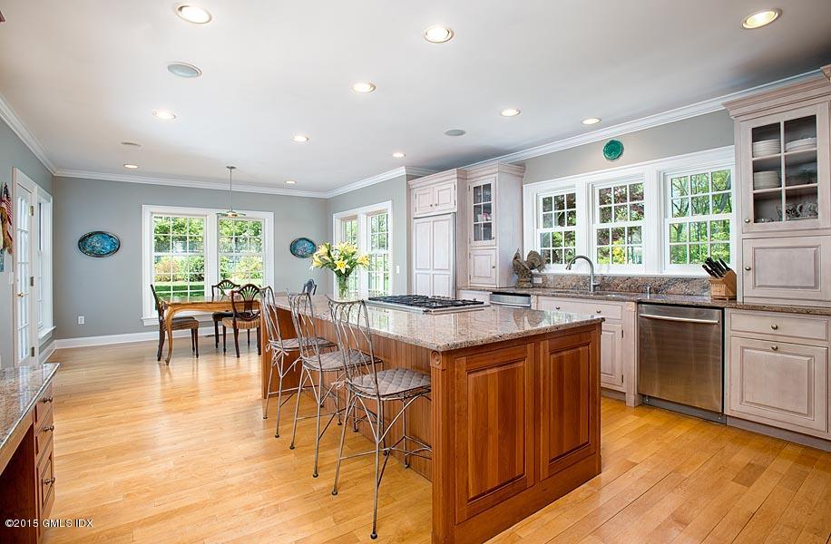 15 Owenoke Way Riverside, CT 06878 - Photo 8 of 22 a kitchen with lots of counter top space and dining table