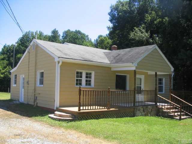 1120 Clayton Road Durham, NC 27703 - Photo 1 of 8 a view of a house with a yard