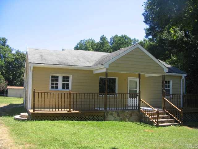 1120 Clayton Road Durham, NC 27703 - Photo 2 of 8 a front view of a house with a yard