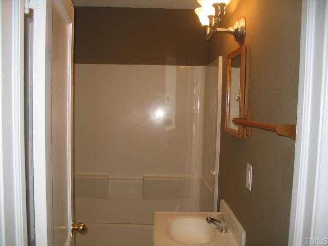 1120 Clayton Road Durham, NC 27703 - Photo 8 of 8 a bathroom with a shower