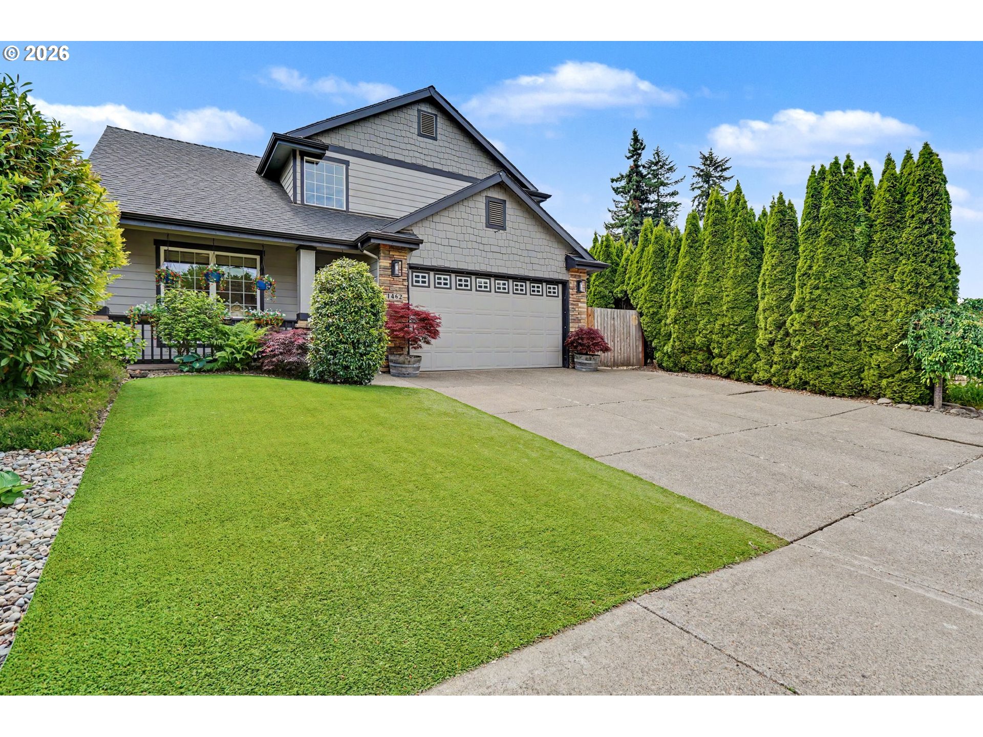 1462 Barnick Road Northeast Keizer, OR 97303 - Photo 2 of 48 a front view of a house with a yard and garage