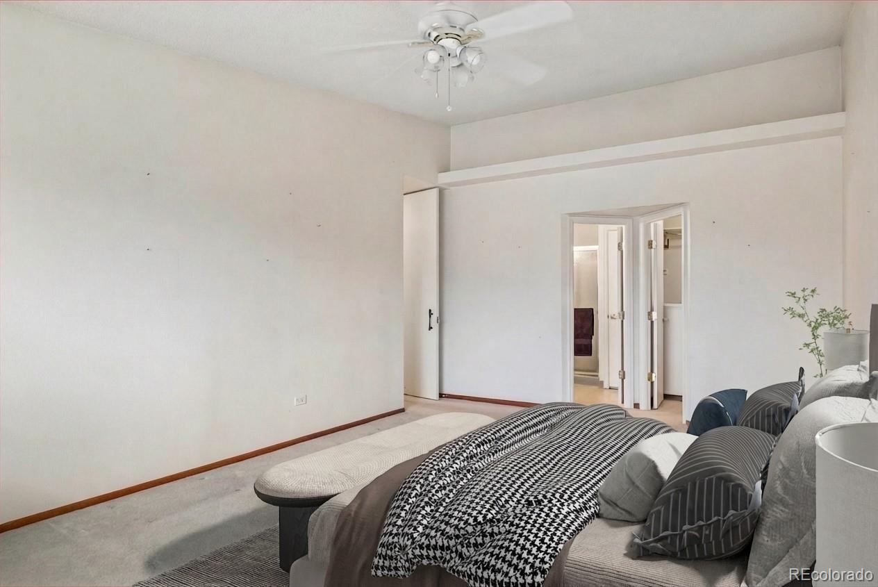 650 South Clinton Street, Unit 5D Denver, CO 80247 - Photo 12 of 48 a bedroom with a bed and a chandelier