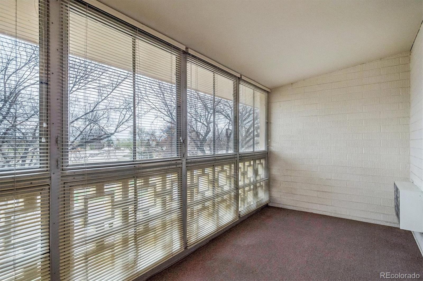 650 South Clinton Street, Unit 5D Denver, CO 80247 - Photo 18 of 48 a view of an empty room with windows