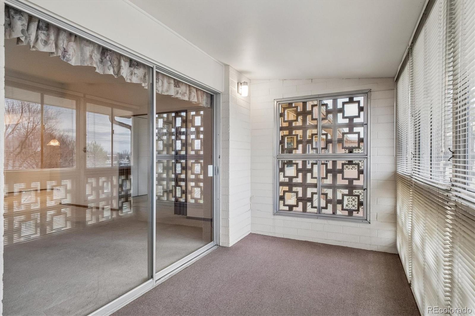 650 South Clinton Street, Unit 5D Denver, CO 80247 - Photo 19 of 48 a view of an entryway with a floor to ceiling window