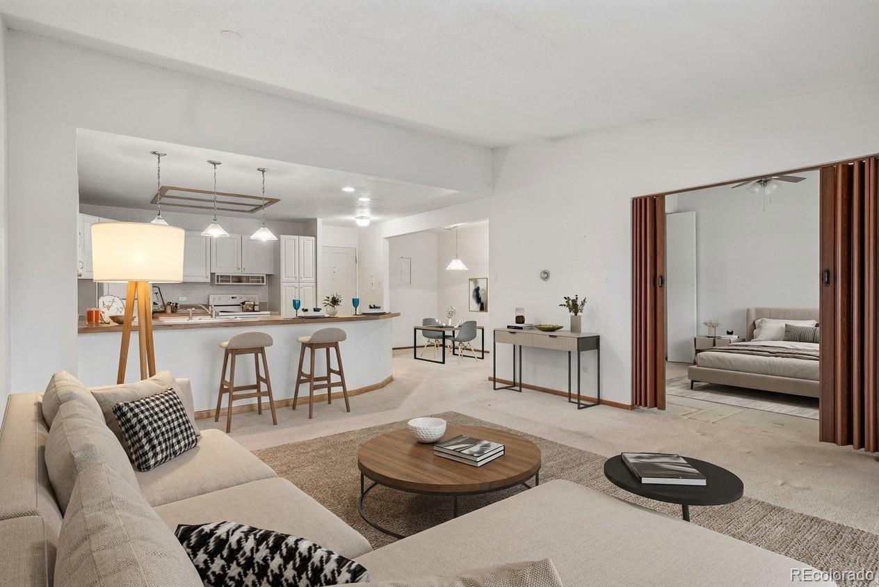 650 South Clinton Street, Unit 5D Denver, CO 80247 - Photo 2 of 48 a living room with furniture kitchen view and a large window