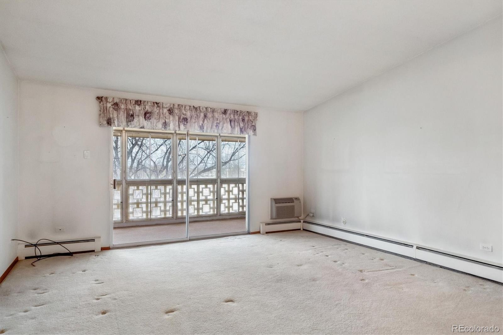 650 South Clinton Street, Unit 5D Denver, CO 80247 - Photo 8 of 48 an empty room with windows