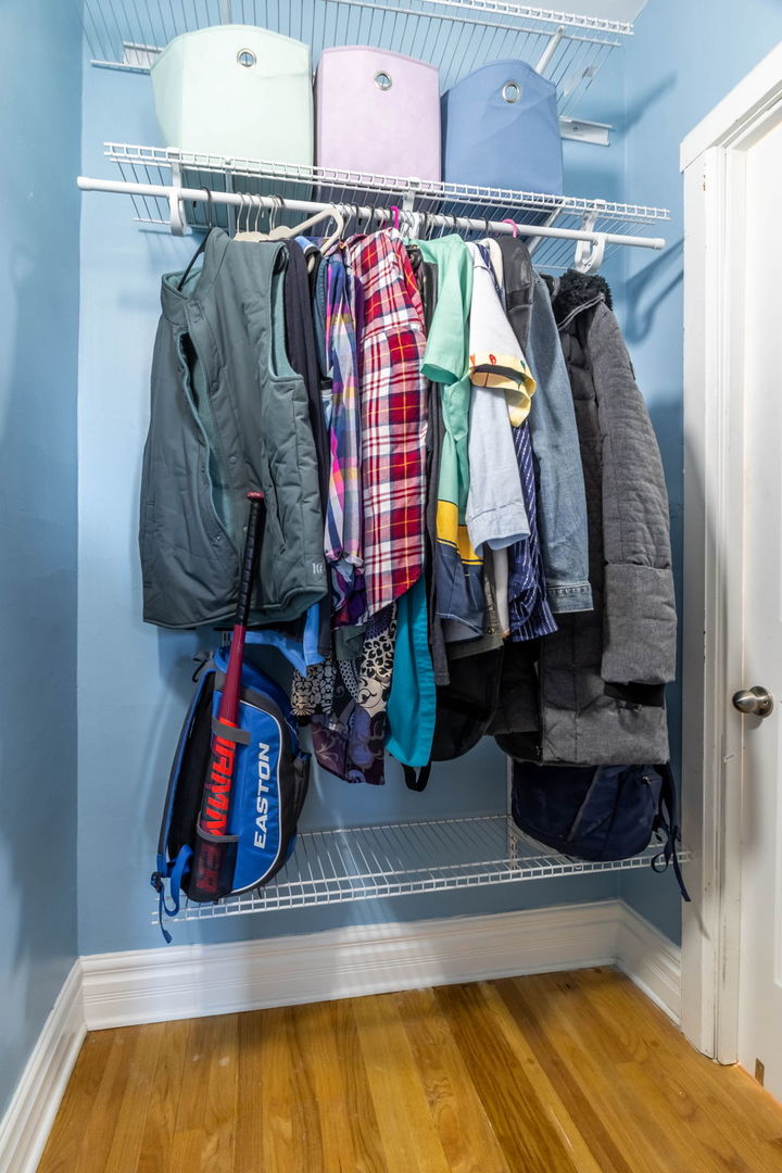 3737 North Pulaski Road, Unit 3S Chicago, IL 60641 - Photo 12 of 25 a view of walk in closet with clothes and shoes