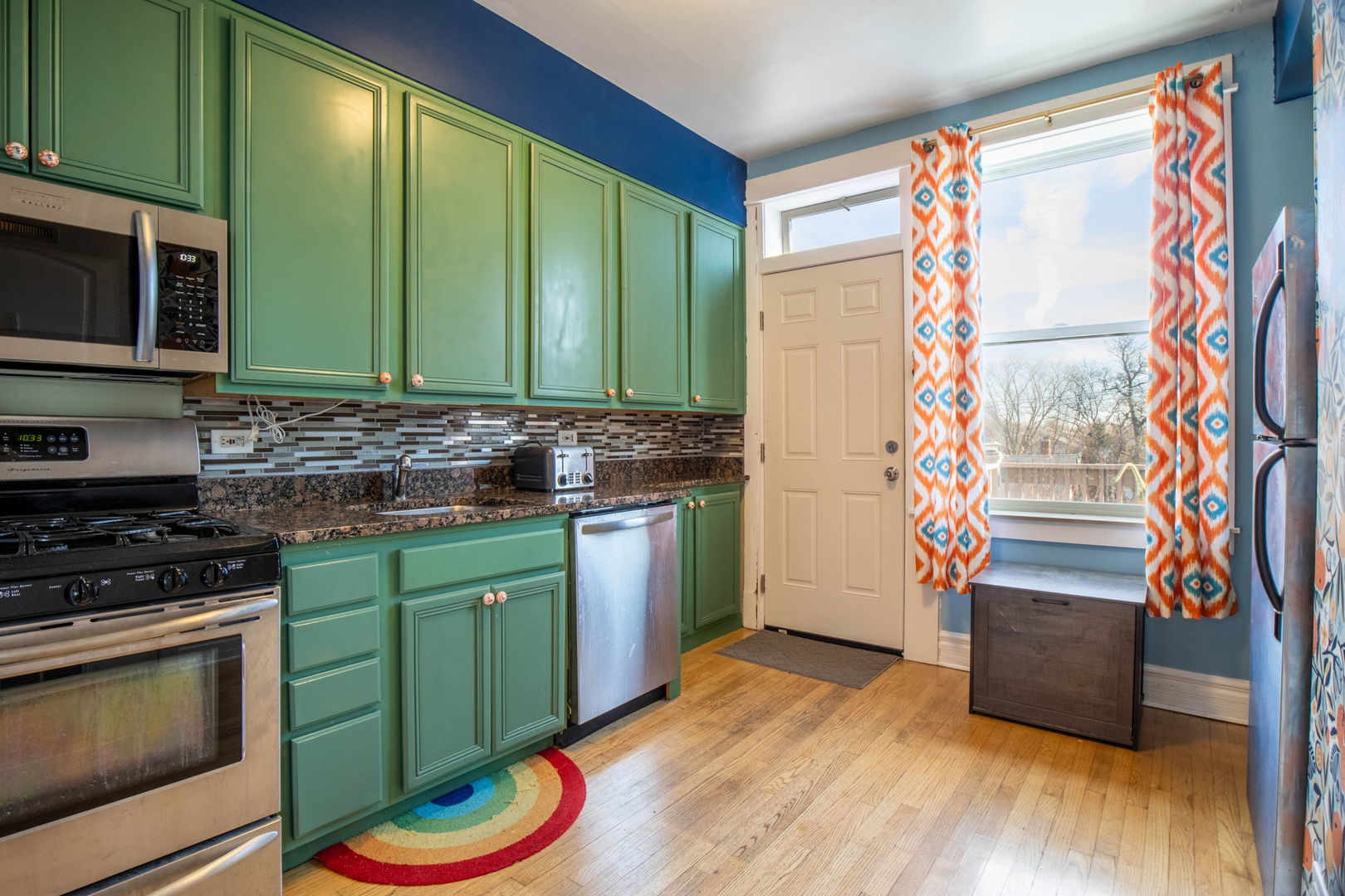 3737 North Pulaski Road, Unit 3S Chicago, IL 60641 - Photo 2 of 25 a kitchen with stainless steel appliances granite countertop a sink and a microwave