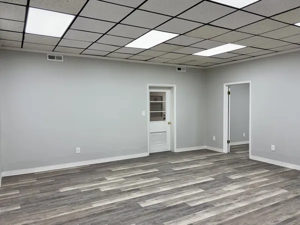 a view of a room with a wooden floor