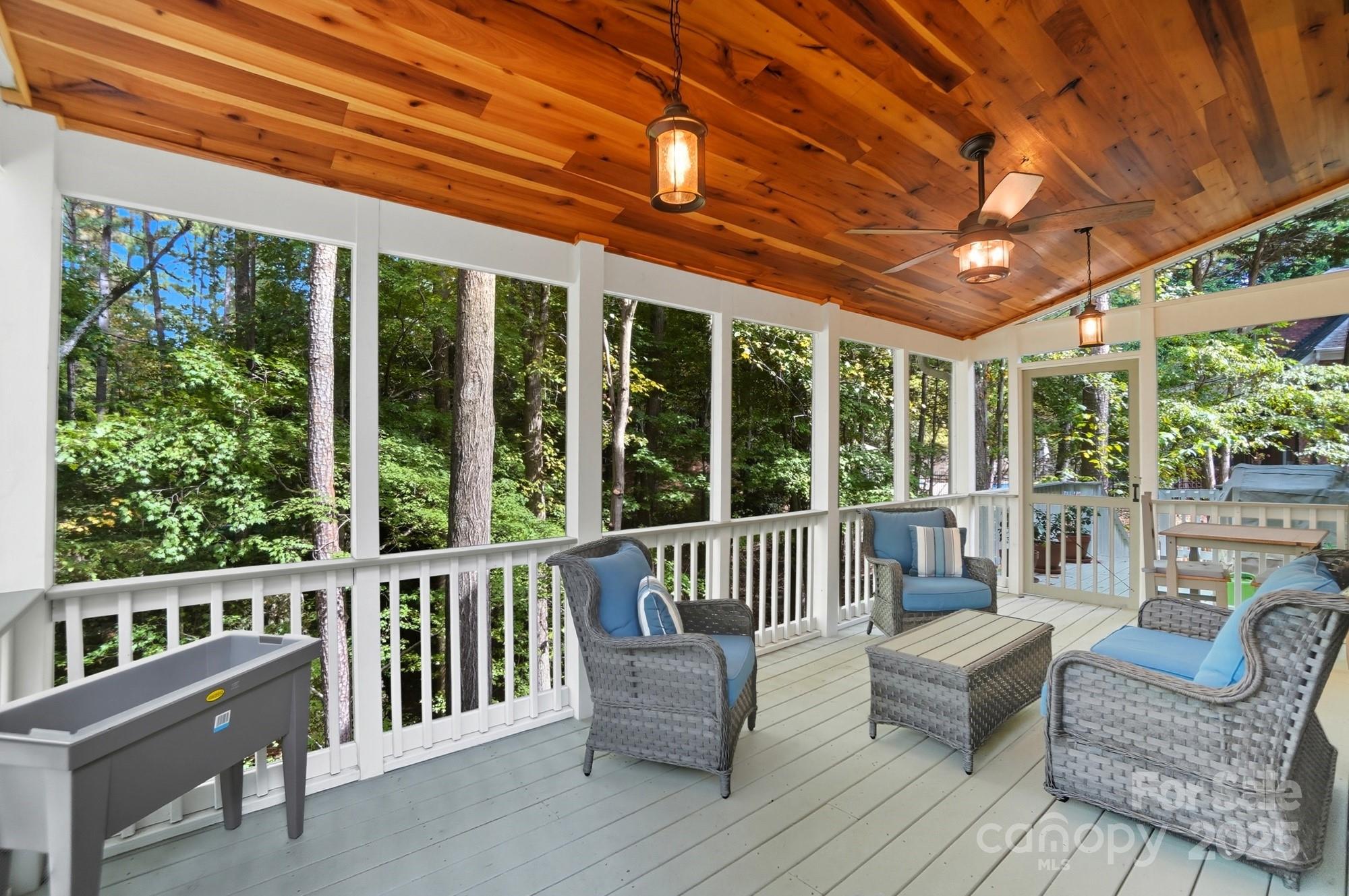 a balcony with furniture and wooden roof