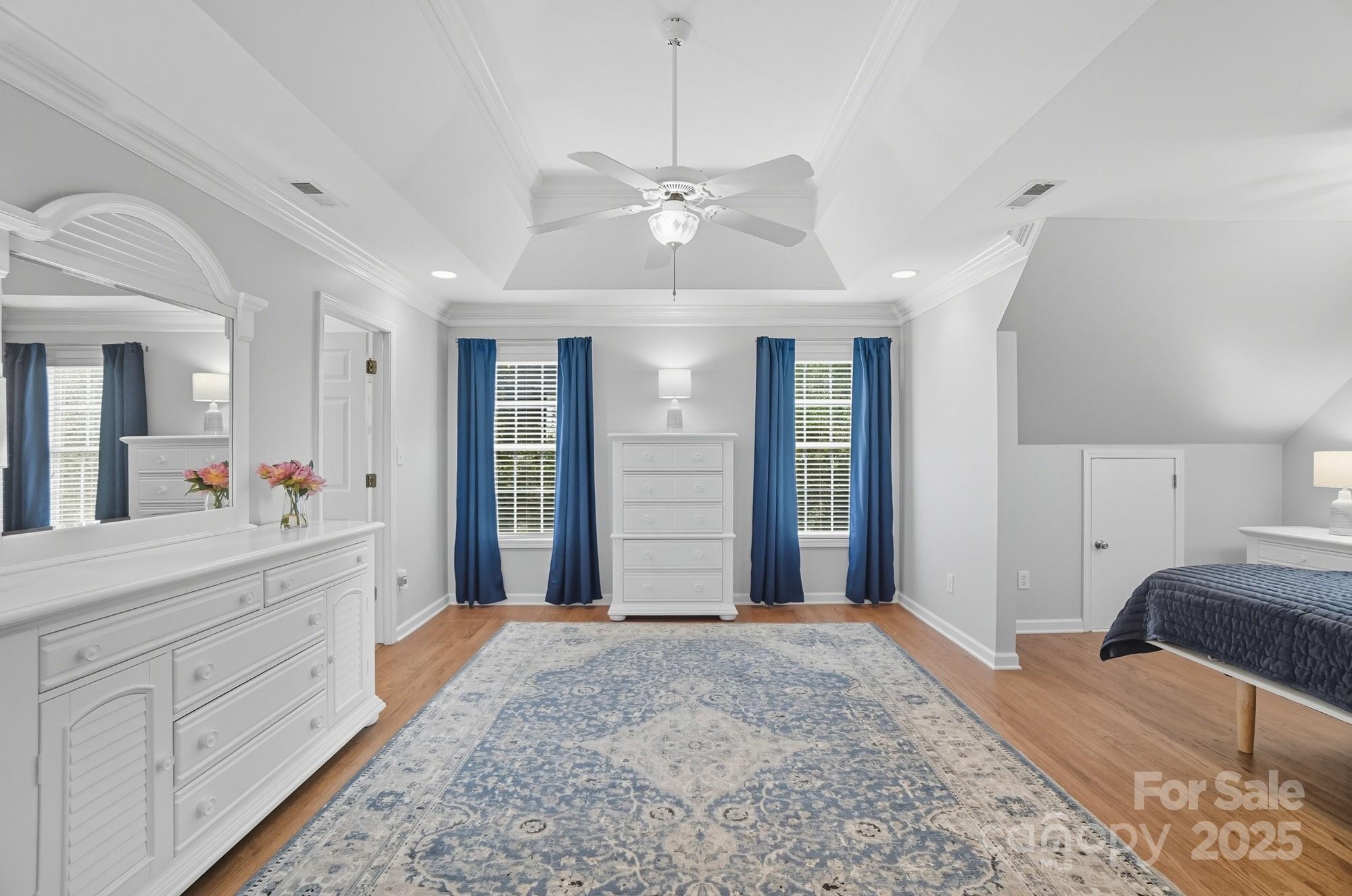 11177 Watertrace Drive Tega Cay, SC 29708 - Photo 13 of 28 a spacious bathroom with a granite countertop sink a mirror and a shower