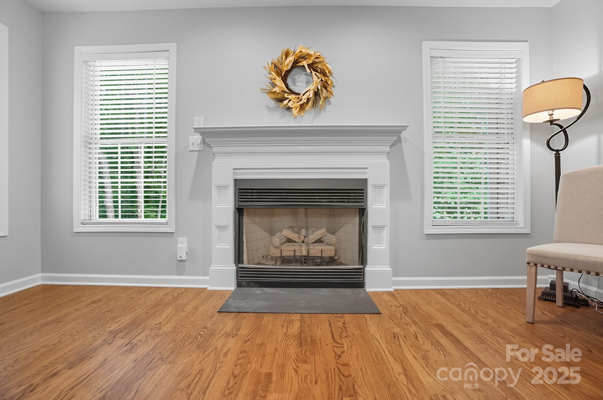 11177 Watertrace Drive Tega Cay, SC 29708 - Photo 21 of 28 an empty room with windows and fireplace