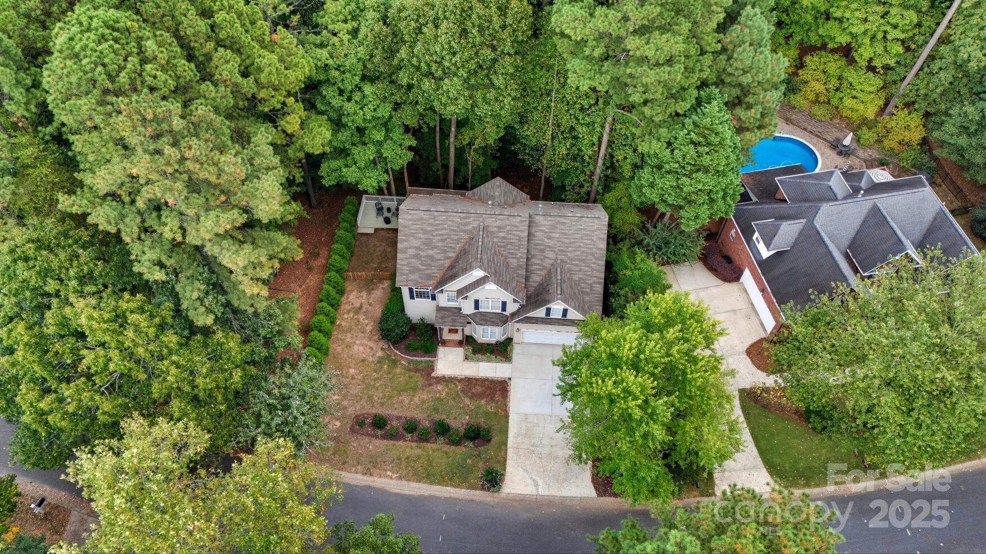 11177 Watertrace Drive Tega Cay, SC 29708 - Photo 27 of 28 an aerial view of a house with garden space and street view