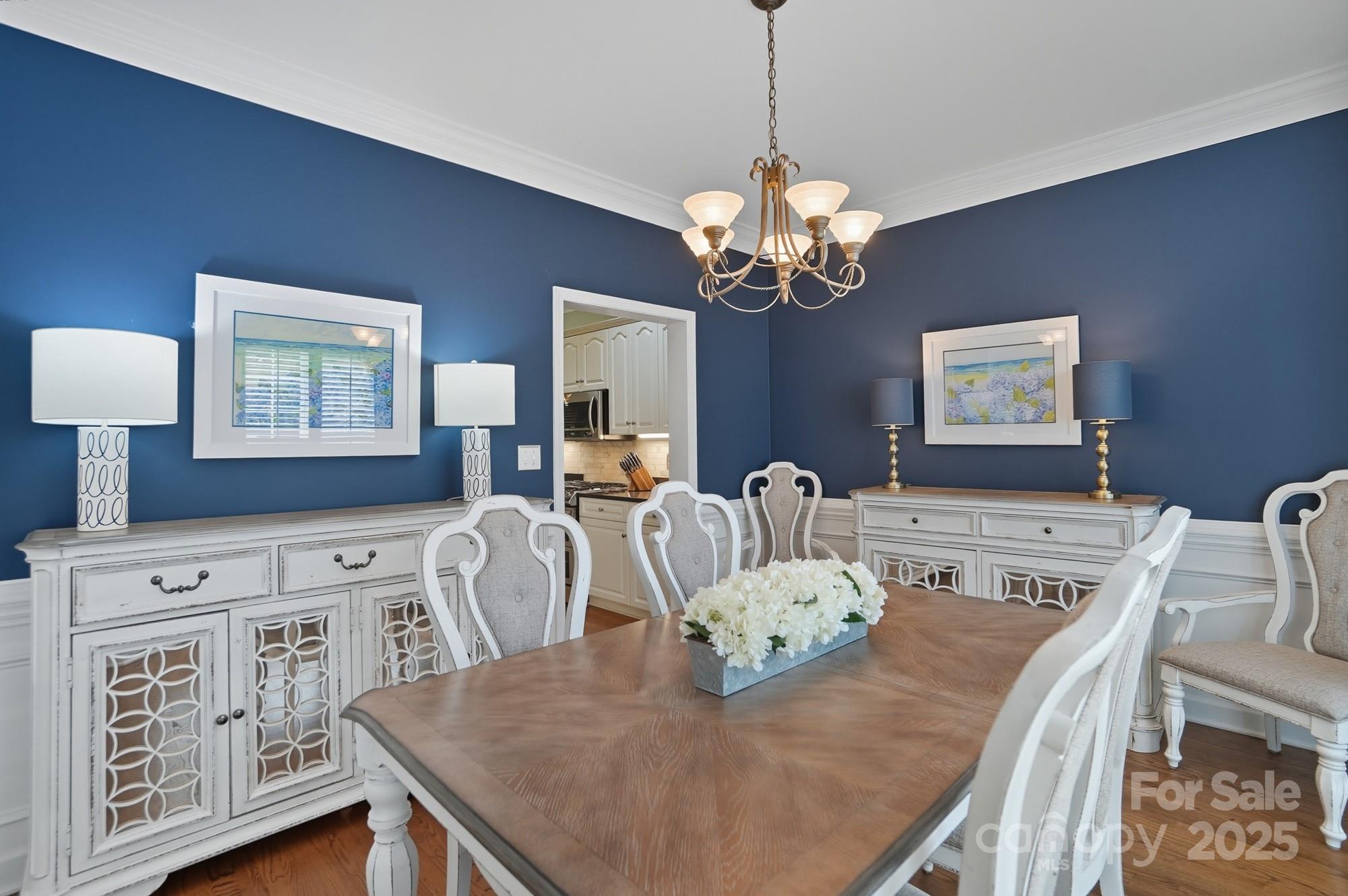 11177 Watertrace Drive Tega Cay, SC 29708 - Photo 5 of 28 a view of a dining room with furniture a chandelier and window