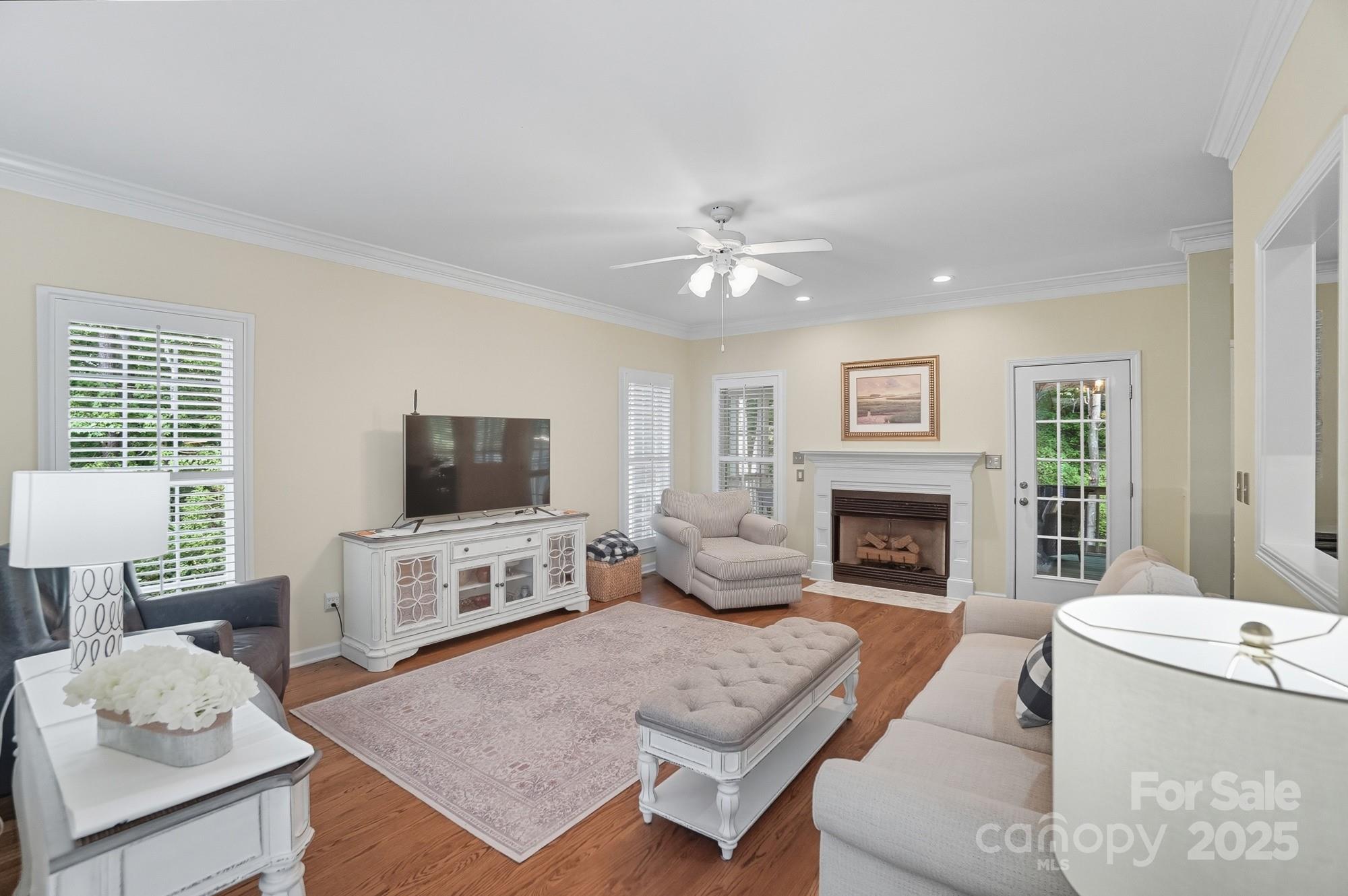 11177 Watertrace Drive Tega Cay, SC 29708 - Photo 6 of 28 a living room with furniture and a fireplace