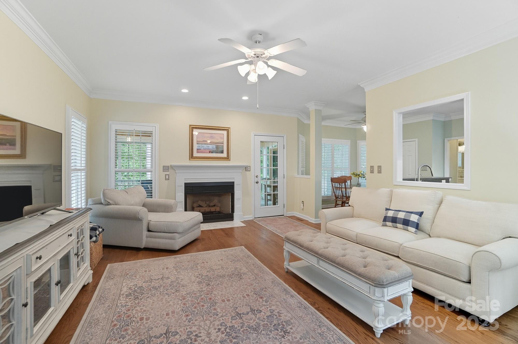 11177 Watertrace Drive Tega Cay, SC 29708 - Photo 7 of 28 a living room with furniture and a fireplace