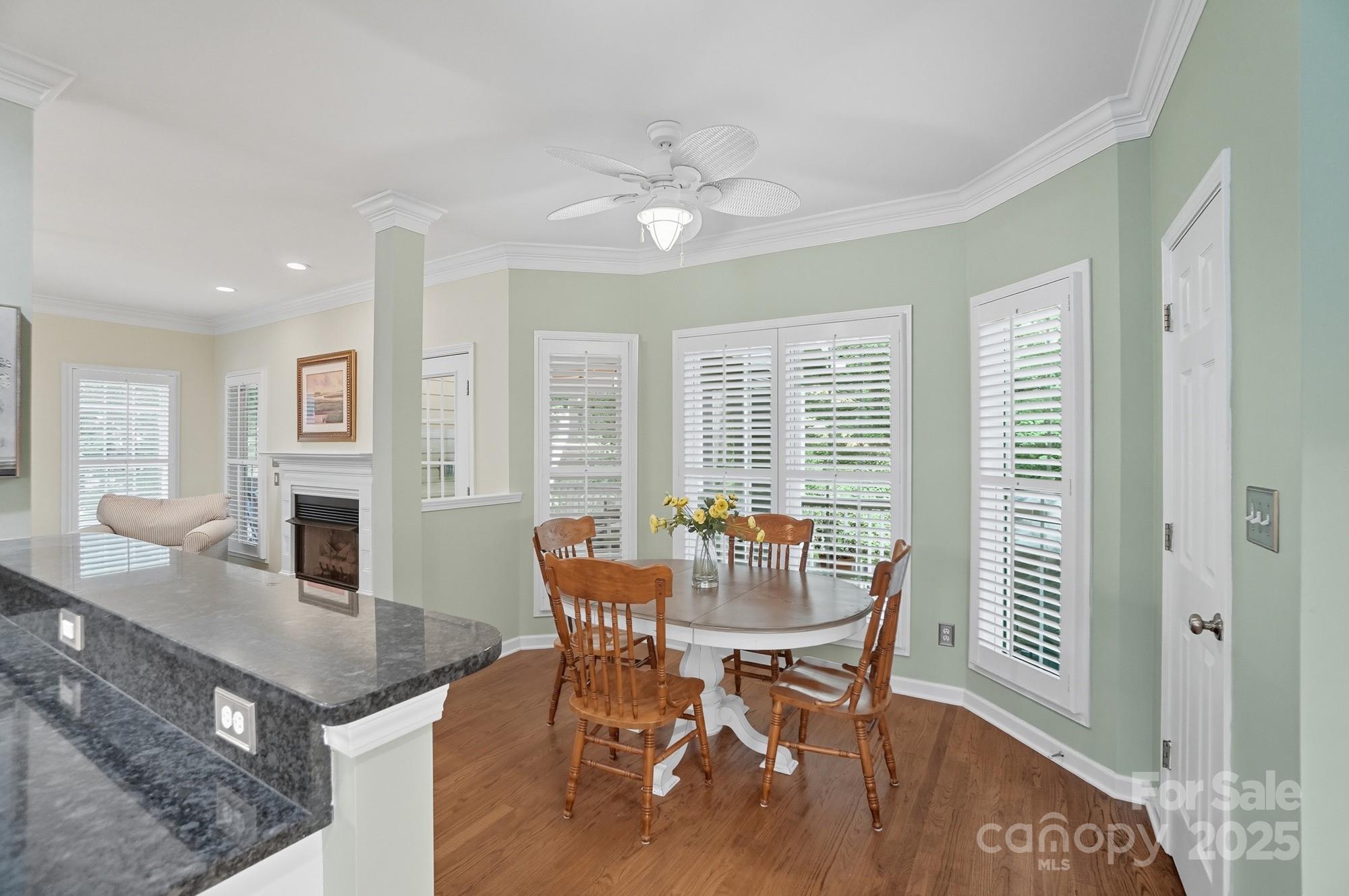 11177 Watertrace Drive Tega Cay, SC 29708 - Photo 8 of 28 a dining room with furniture window and wooden floor
