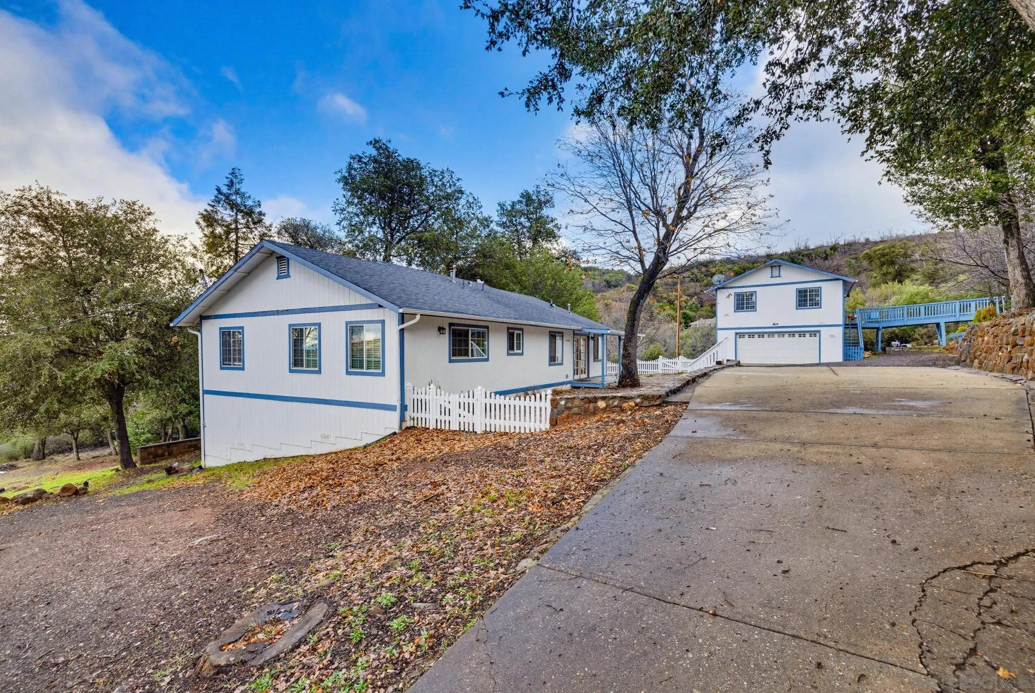 17009 Iron Springs Road Julian, CA 92036 - Photo 2 of 70 a front view of a house with a yard and large tree