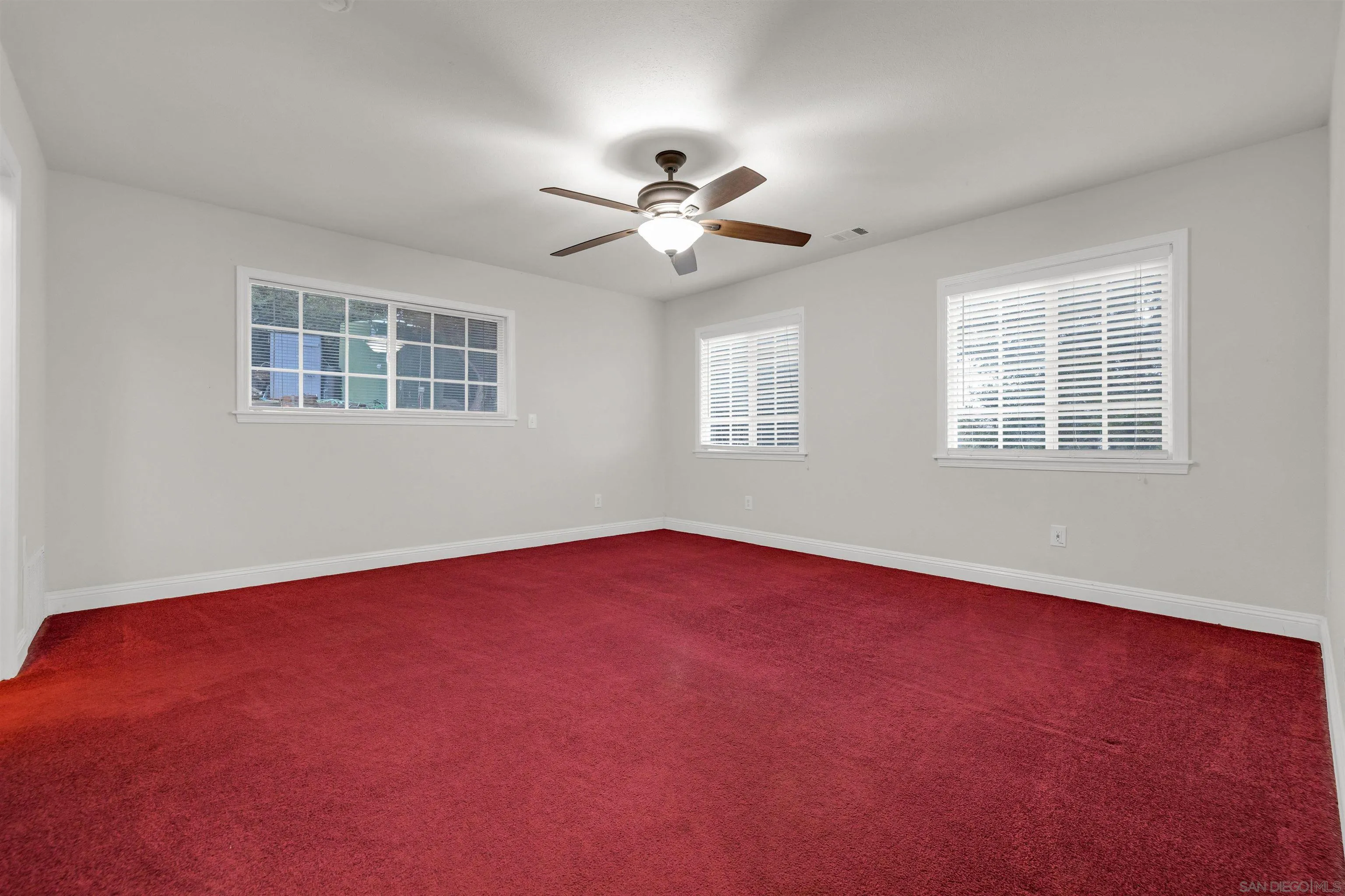 17009 Iron Springs Road Julian, CA 92036 - Photo 25 of 70 an empty room with windows and ceiling fan