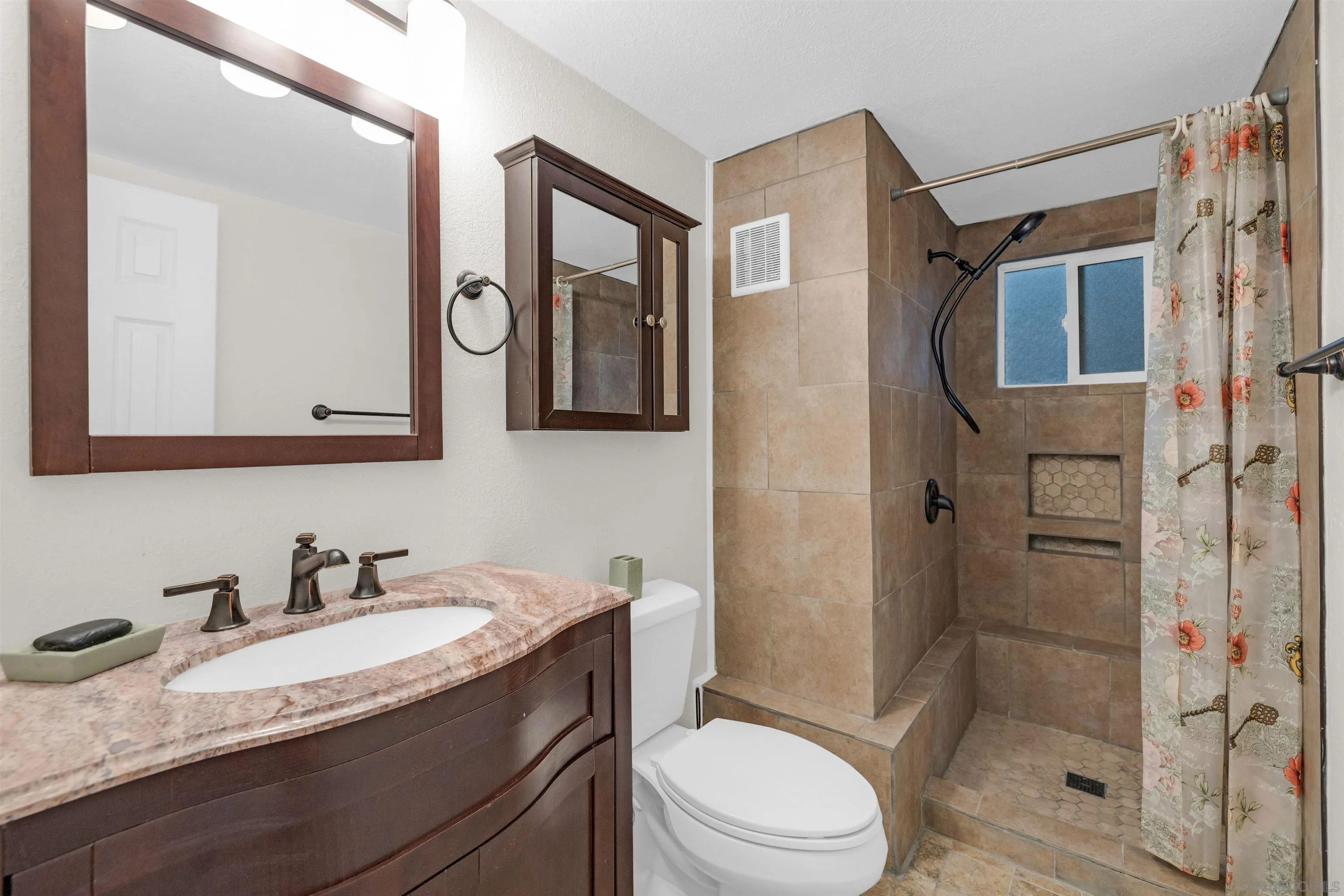 17009 Iron Springs Road Julian, CA 92036 - Photo 40 of 70 a bathroom with a granite countertop sink toilet and shower
