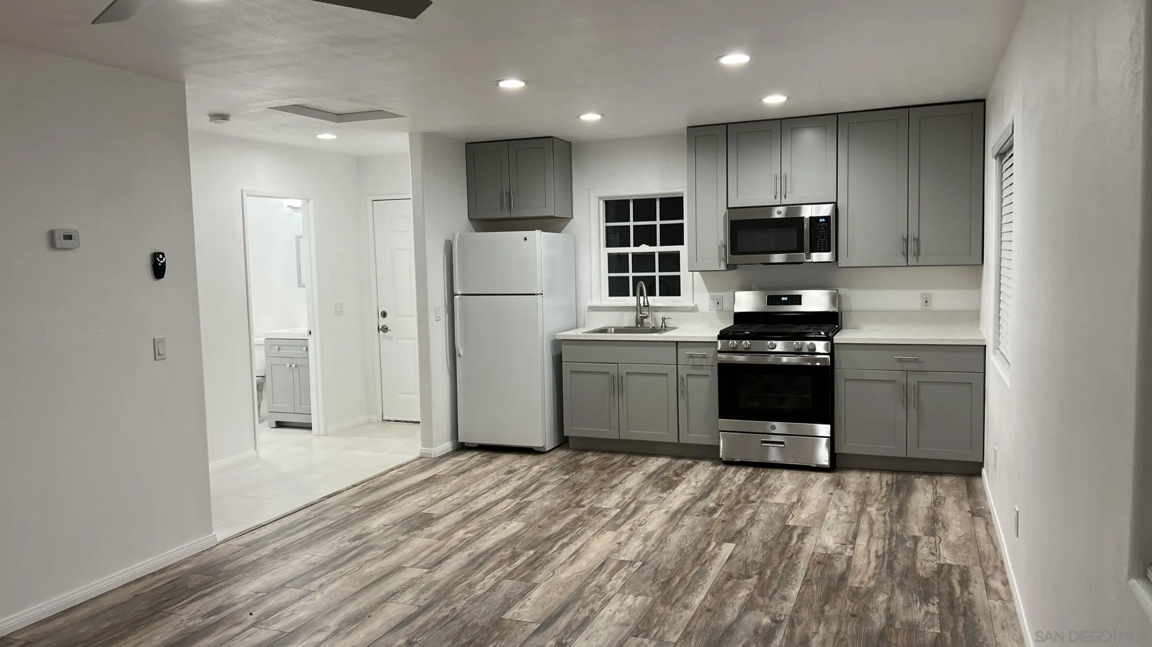 17009 Iron Springs Road Julian, CA 92036 - Photo 50 of 70 a kitchen with stainless steel appliances kitchen island granite countertop a refrigerator and a sink