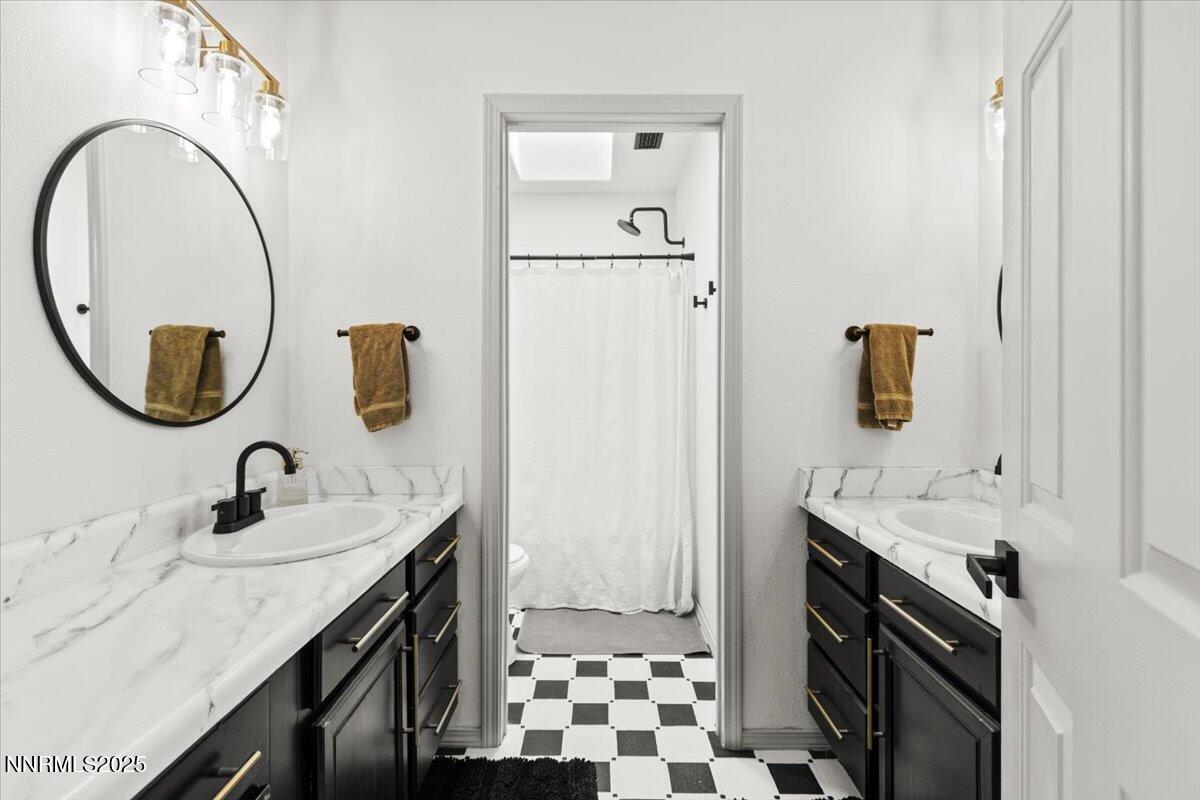 2371 Enterprise Road Reno, NV 89521 - Photo 11 of 25 a bathroom with a sink and a mirror