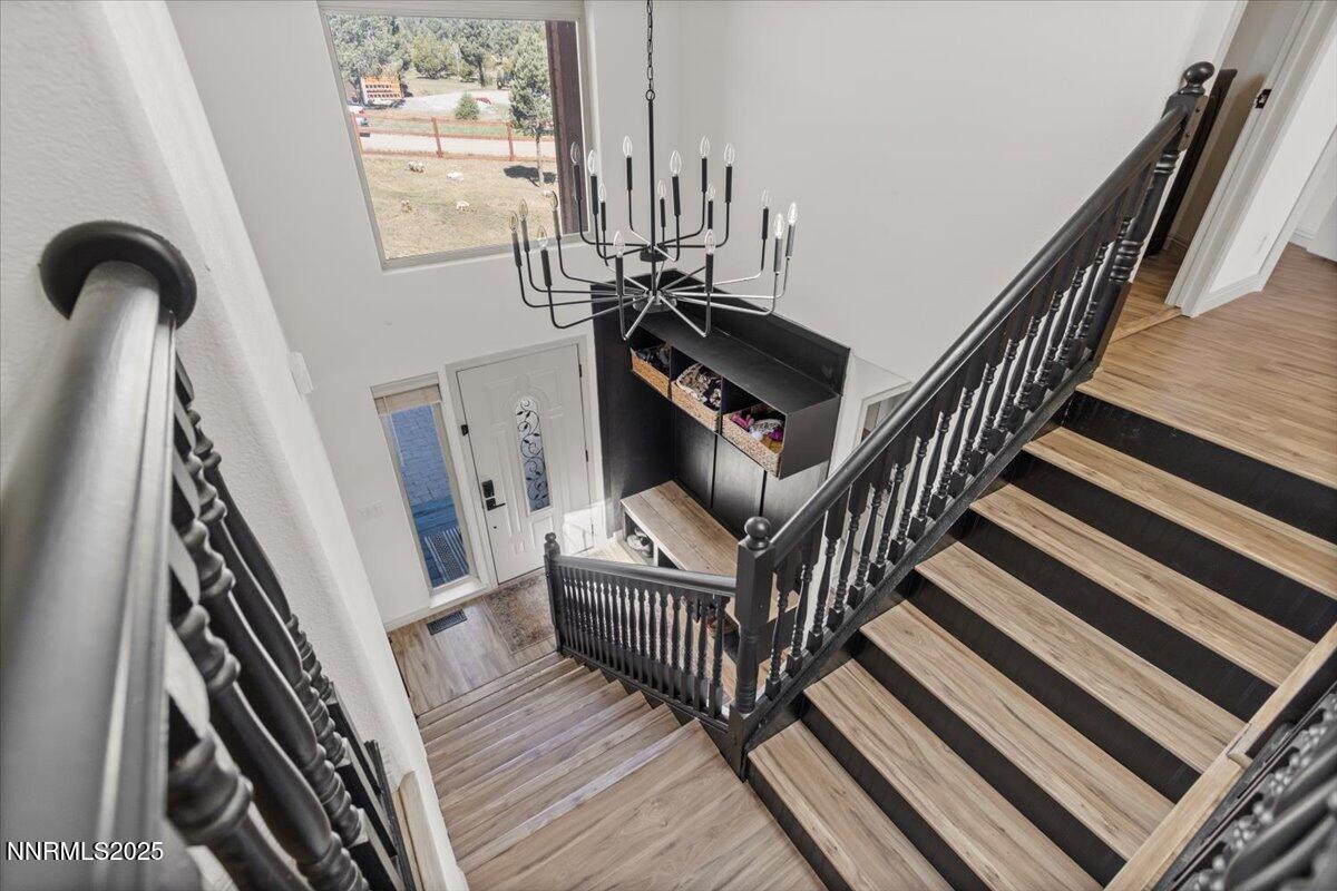 2371 Enterprise Road Reno, NV 89521 - Photo 15 of 25 a view of stairs and hall with wooden floor