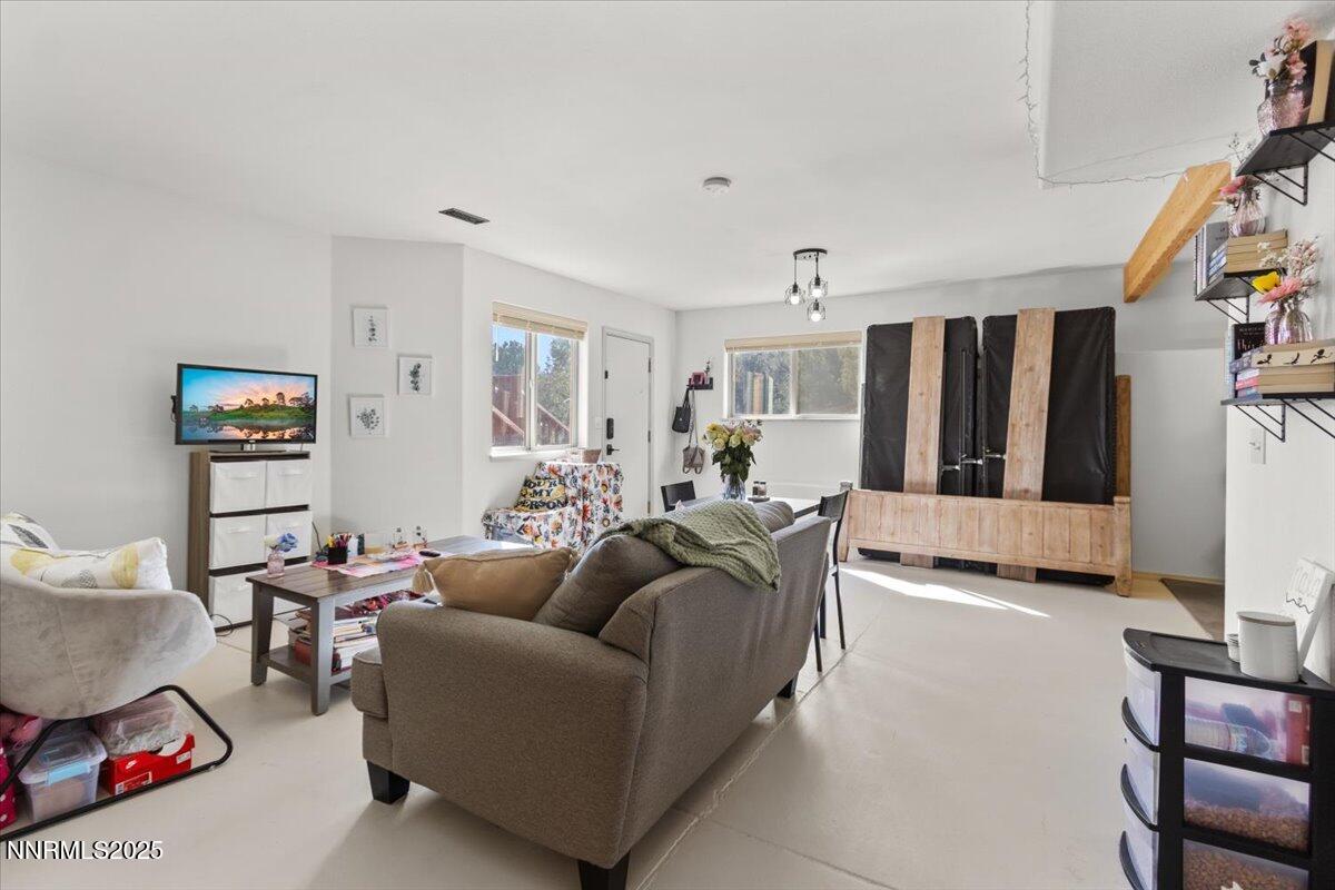 2371 Enterprise Road Reno, NV 89521 - Photo 17 of 25 a living room with furniture and a flat screen tv