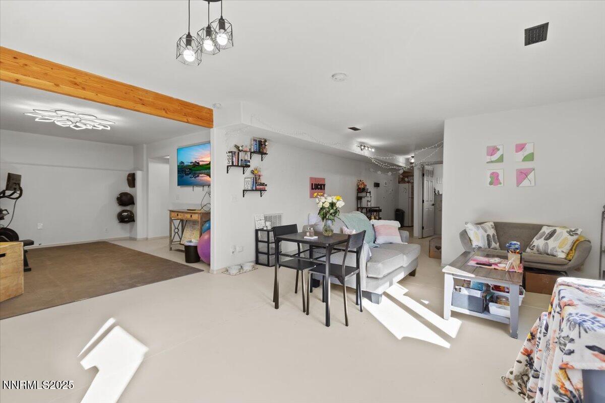 2371 Enterprise Road Reno, NV 89521 - Photo 18 of 25 a living room with furniture and a dining table