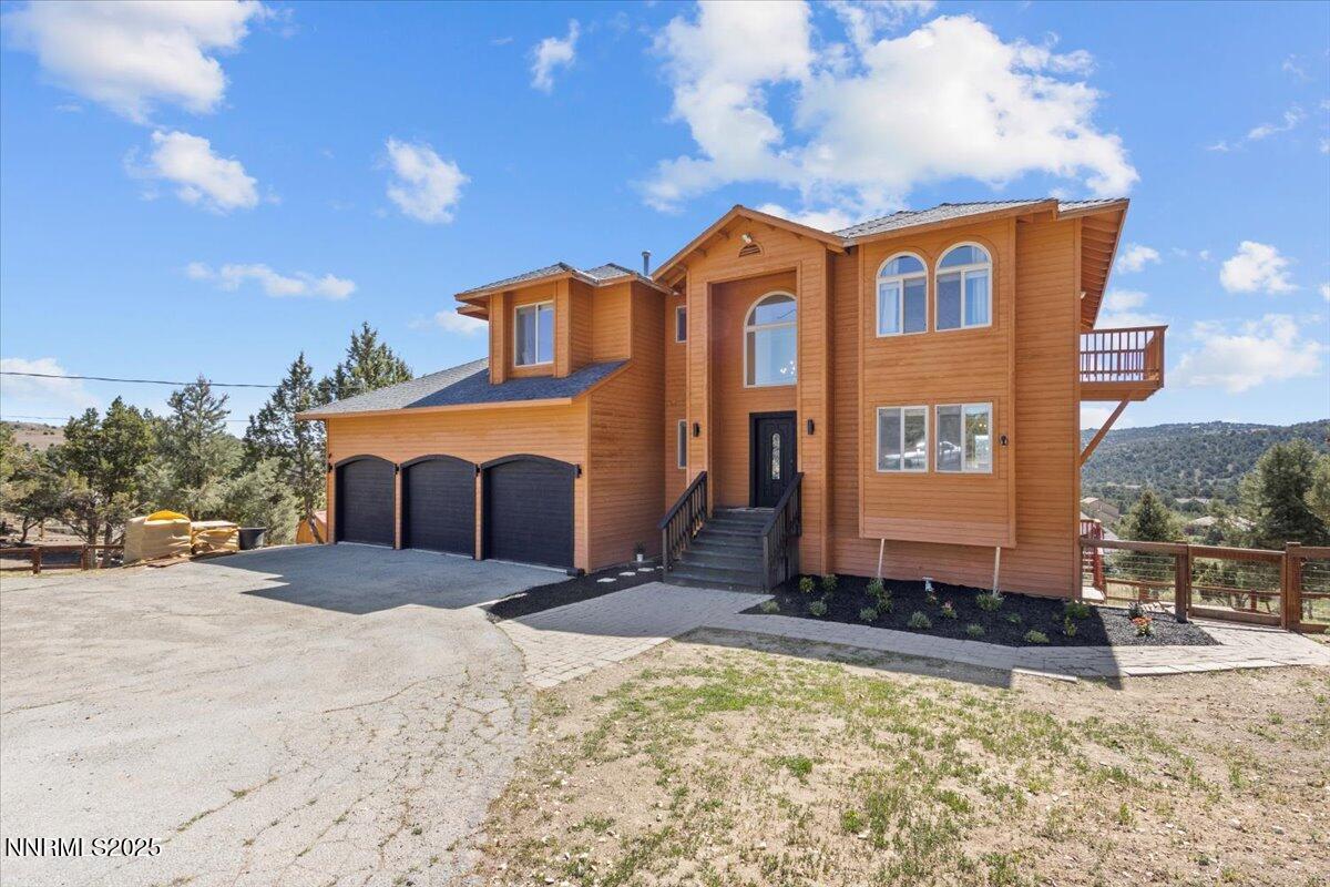 2371 Enterprise Road Reno, NV 89521 - Photo 2 of 25 a front view of a house with a yard