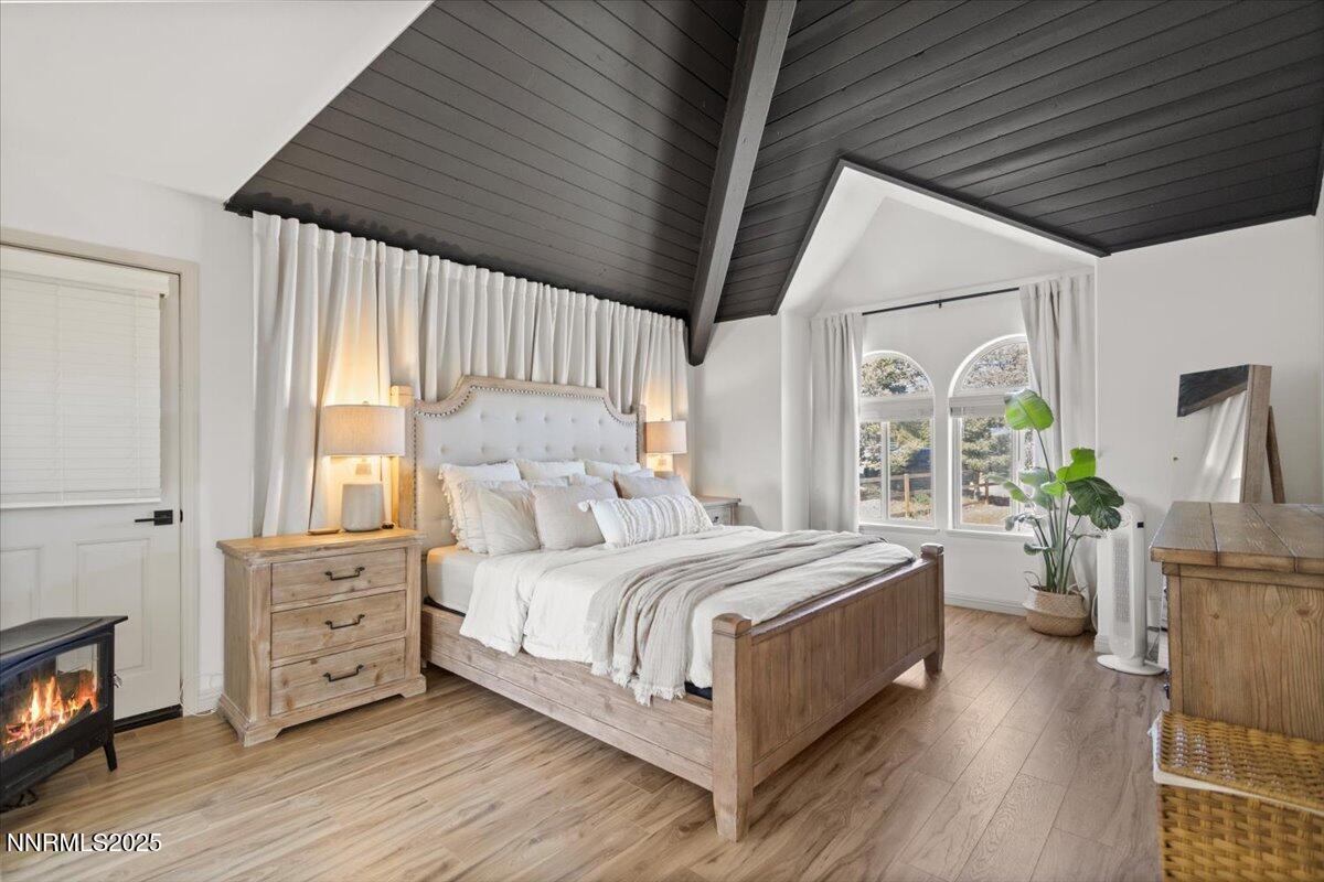 2371 Enterprise Road Reno, NV 89521 - Photo 4 of 25 a bed room with a bed and a large window