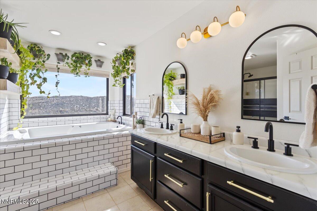 2371 Enterprise Road Reno, NV 89521 - Photo 6 of 25 a bathroom with a double vanity sink and a mirror