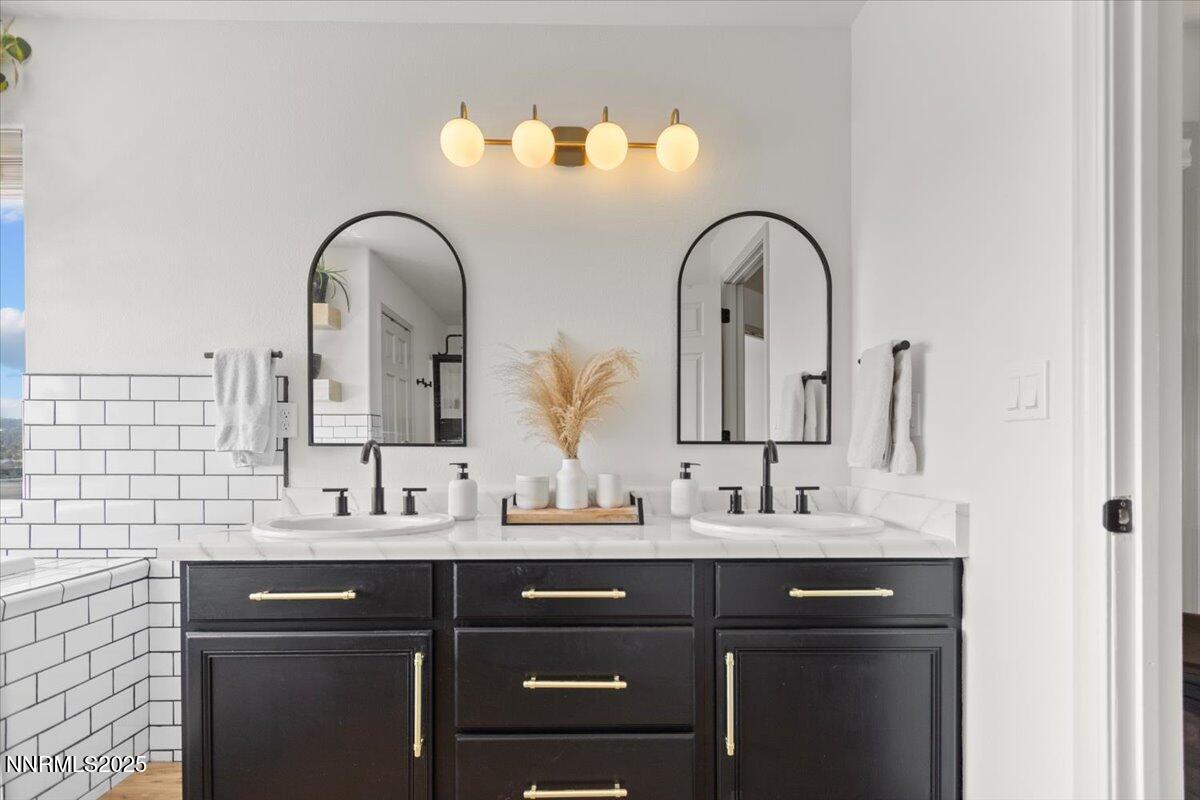 2371 Enterprise Road Reno, NV 89521 - Photo 7 of 25 a bathroom with a double vanity sink and a mirror