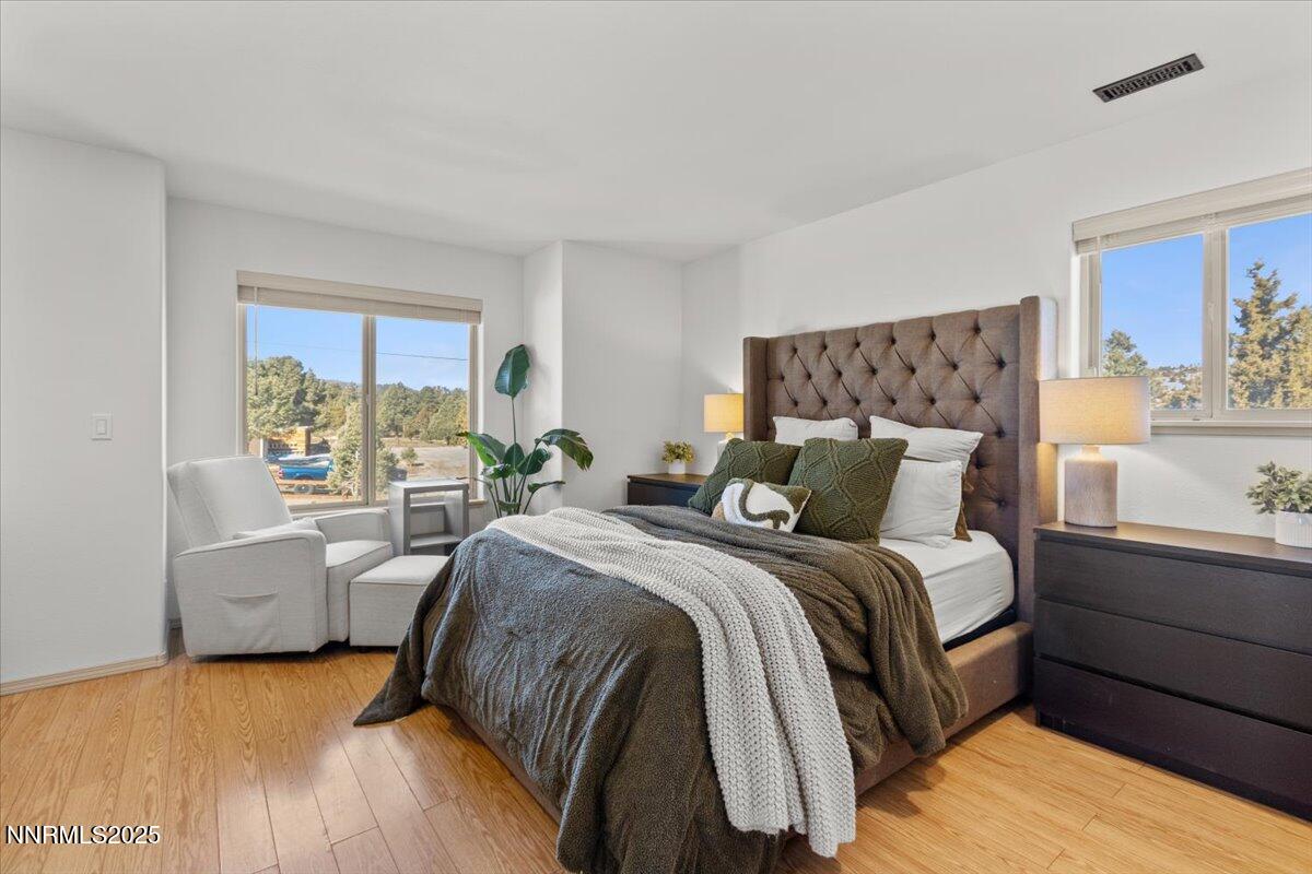 2371 Enterprise Road Reno, NV 89521 - Photo 8 of 25 a bed room with a bed and a couch