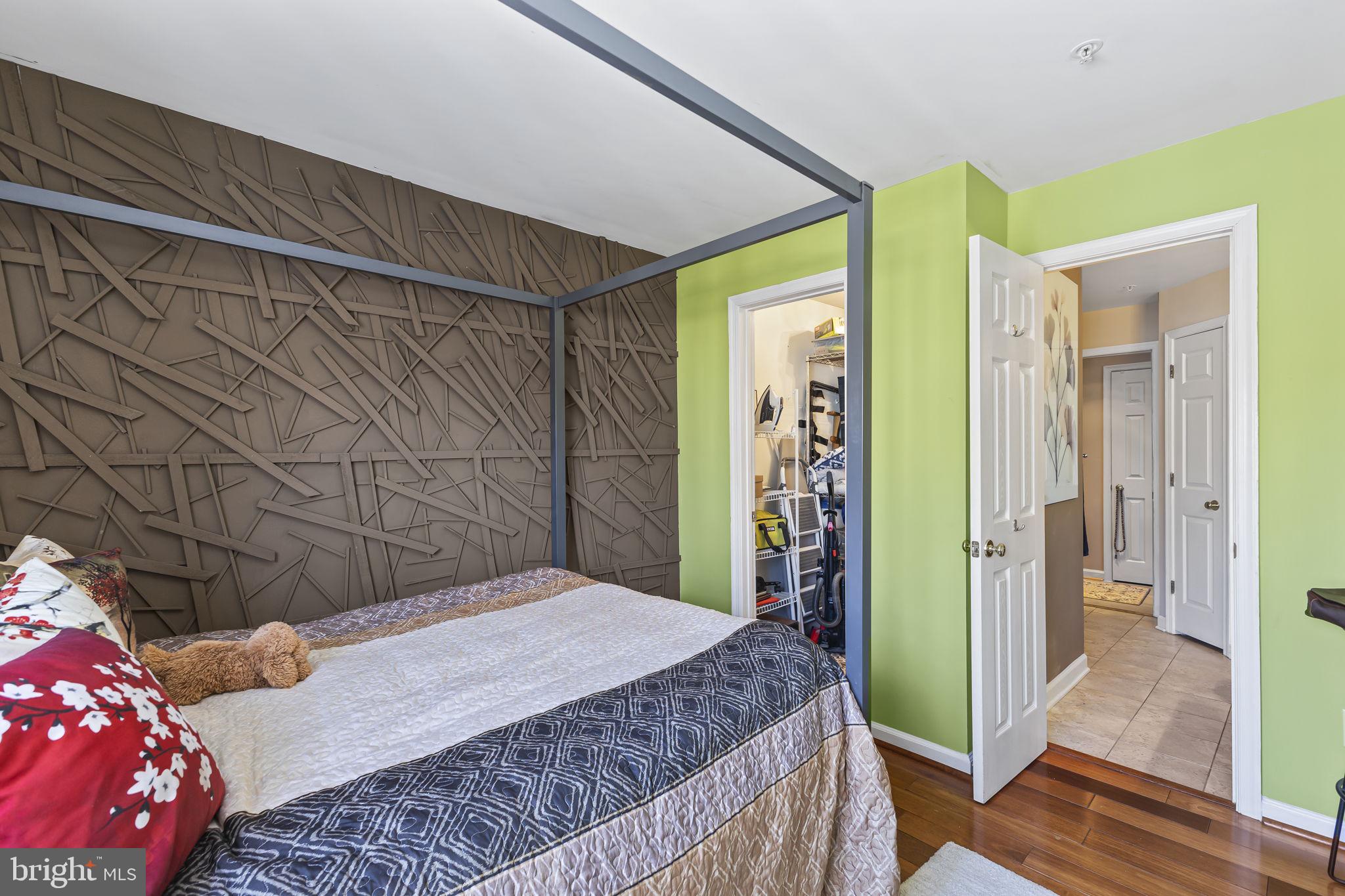 2320 Falls Gable Lane, Unit B Baltimore, MD 21209 - Photo 15 of 26 a bedroom with a bed and a mirror