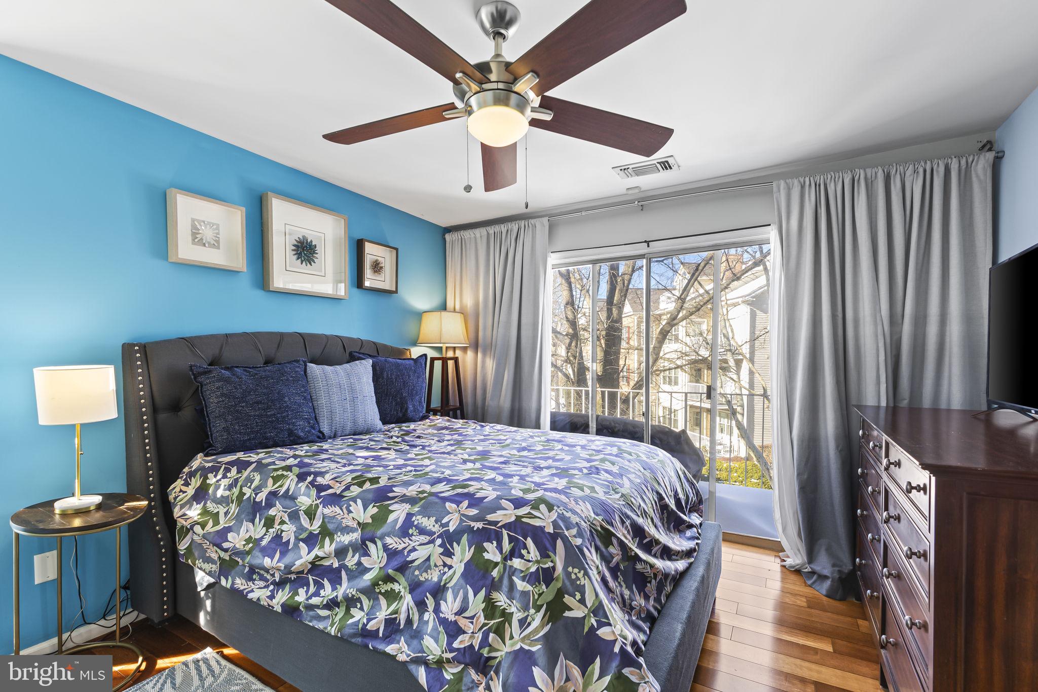 2320 Falls Gable Lane, Unit B Baltimore, MD 21209 - Photo 17 of 26 a bedroom with a bed and a chandelier