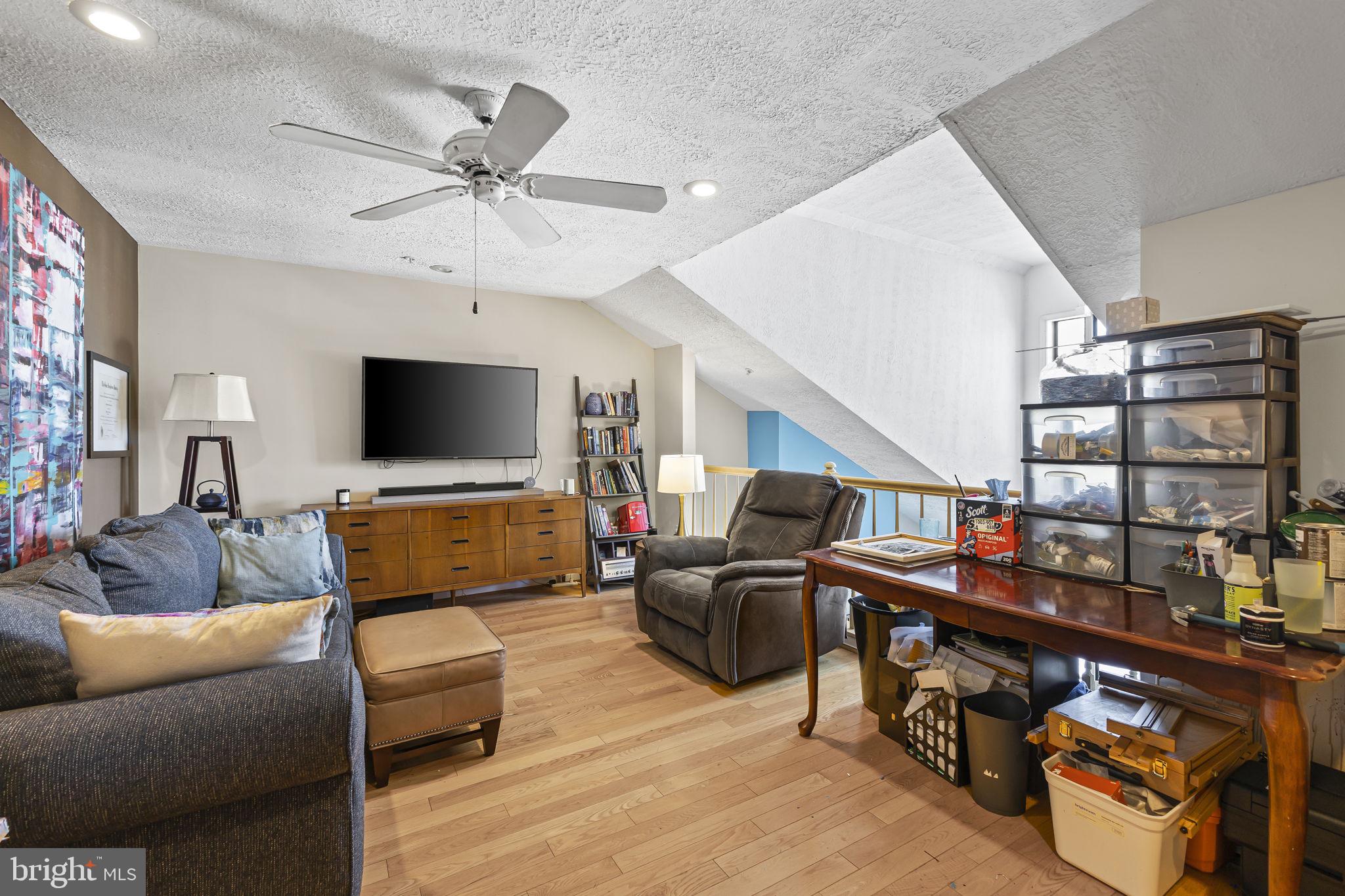 2320 Falls Gable Lane, Unit B Baltimore, MD 21209 - Photo 21 of 26 a living room with furniture and a flat screen tv