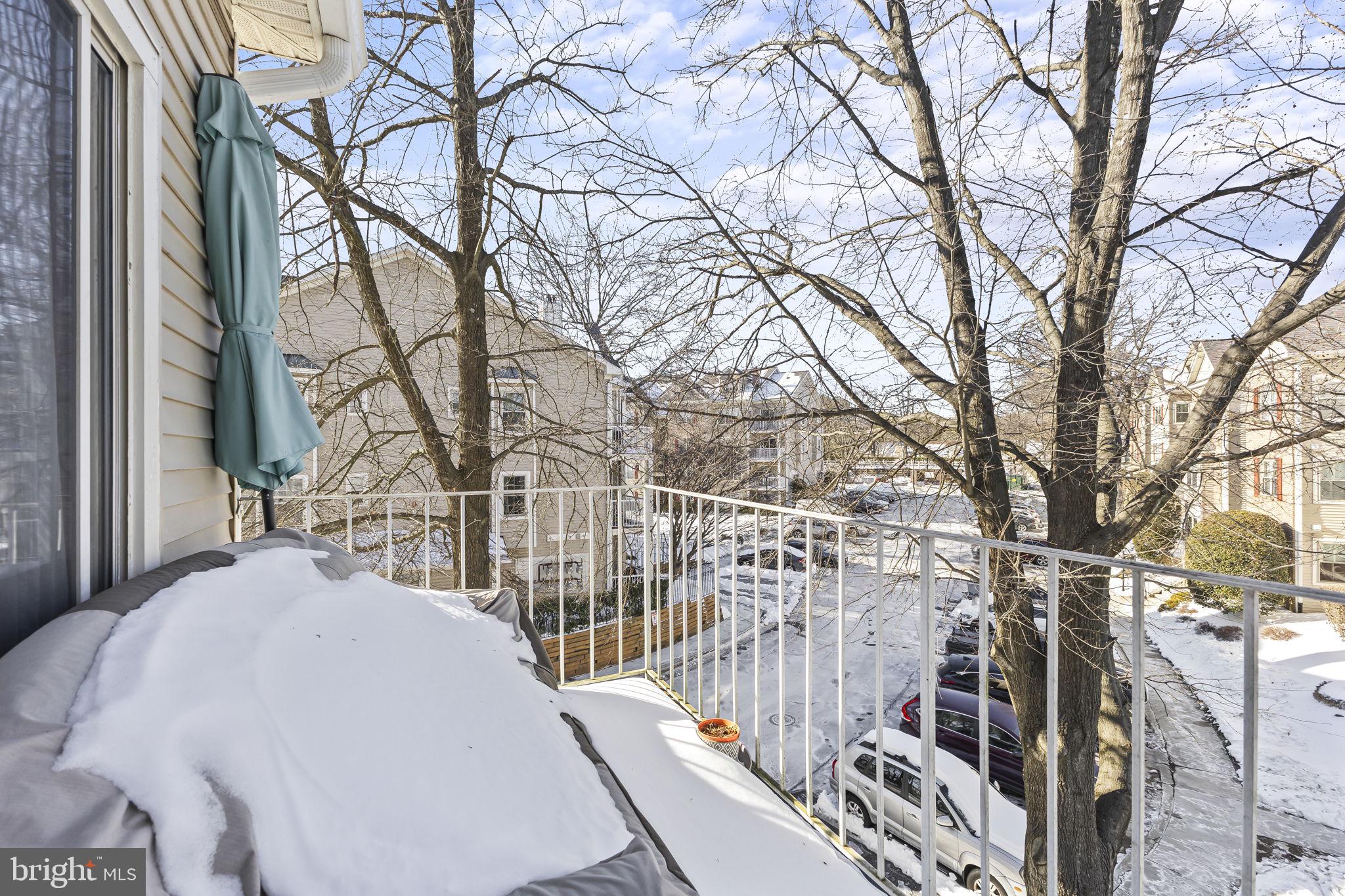 2320 Falls Gable Lane, Unit B Baltimore, MD 21209 - Photo 23 of 26 a view of a white house with a snow in the yard