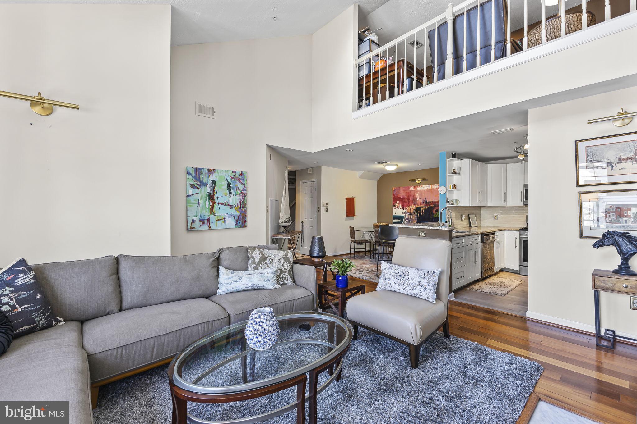 2320 Falls Gable Lane, Unit B Baltimore, MD 21209 - Photo 5 of 26 a living room with furniture and a rug