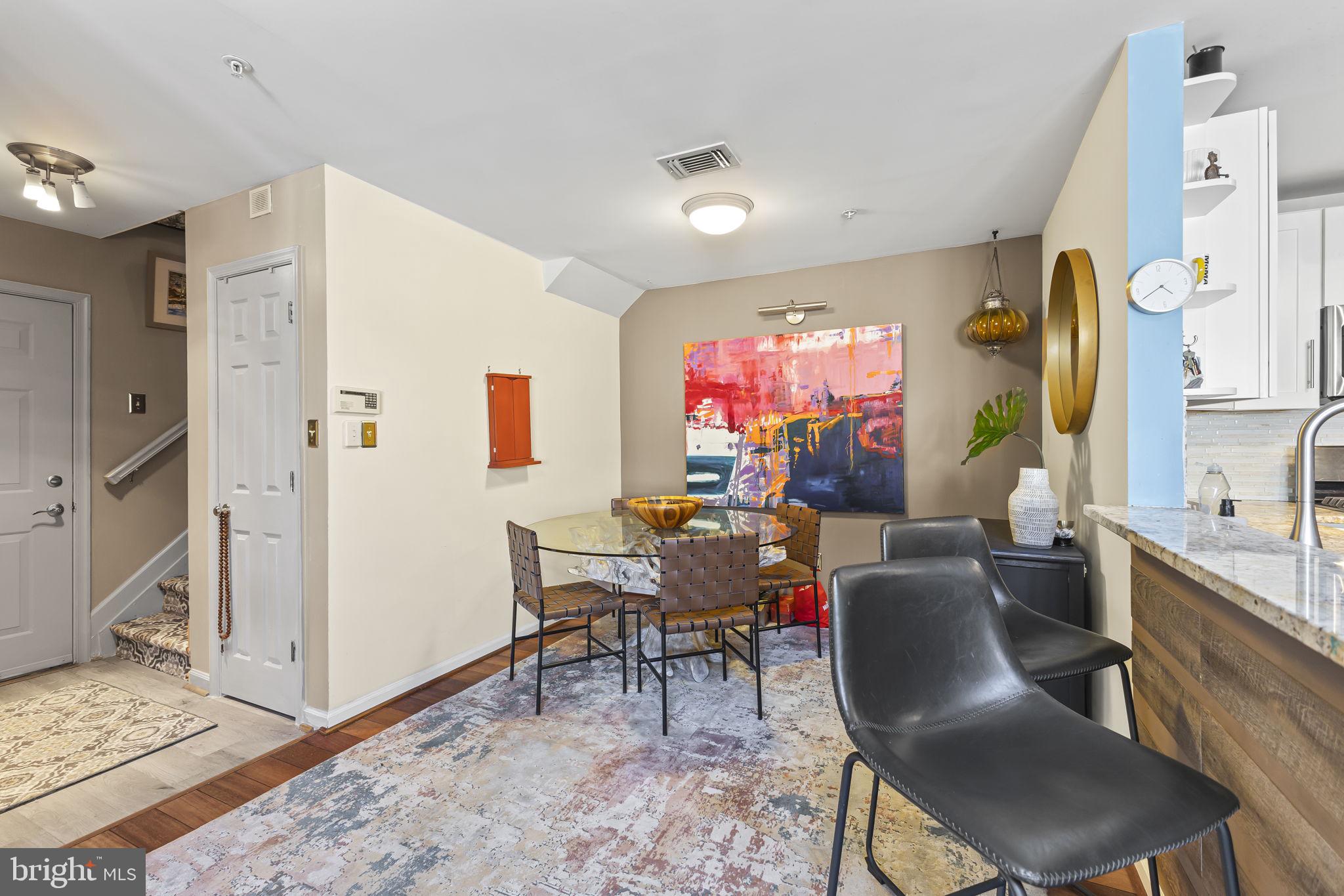 2320 Falls Gable Lane, Unit B Baltimore, MD 21209 - Photo 6 of 26 a view of a dining room with furniture