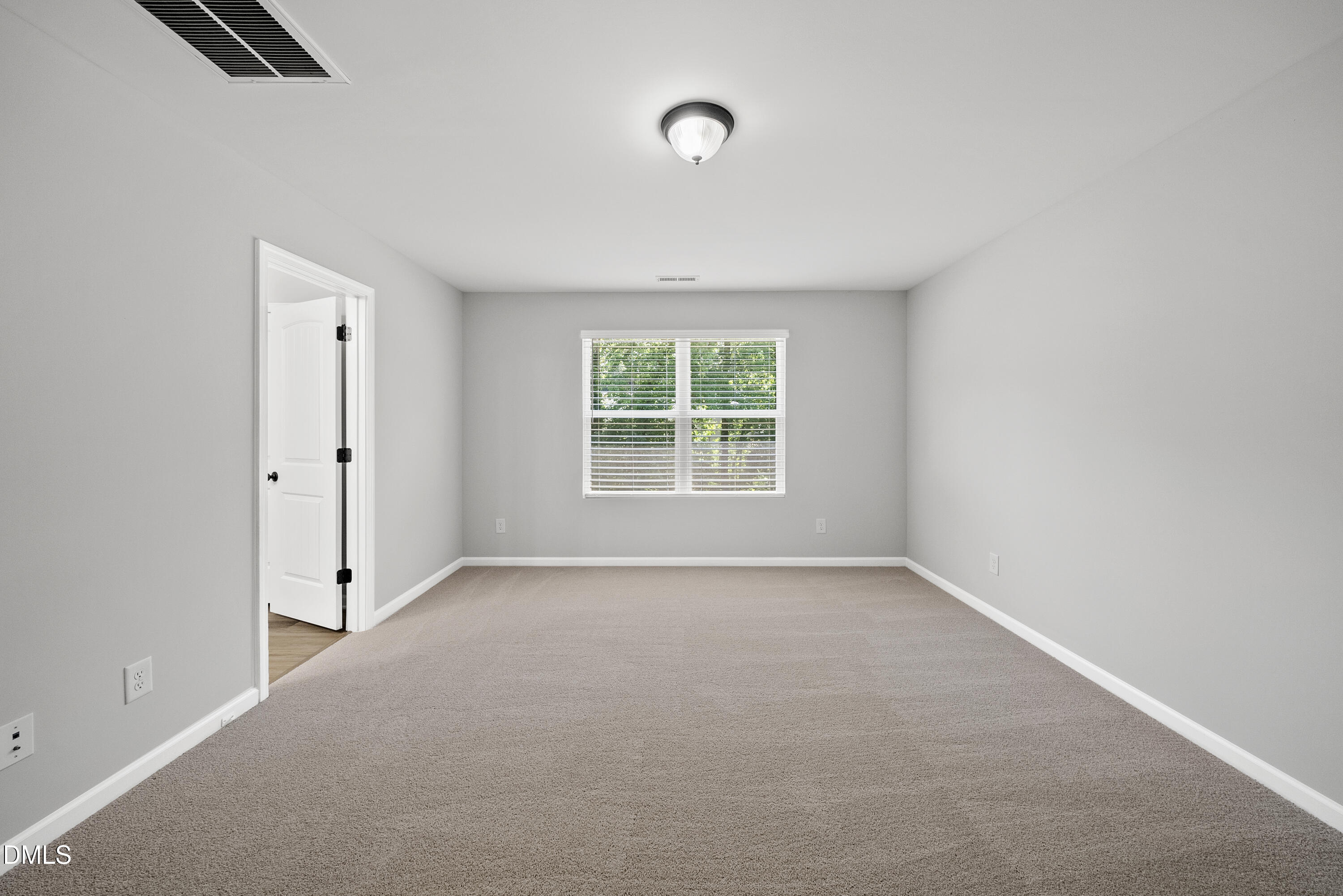 2816 Elsa Drive Raleigh, NC 27610 - Photo 25 of 35 an empty room with windows and closet