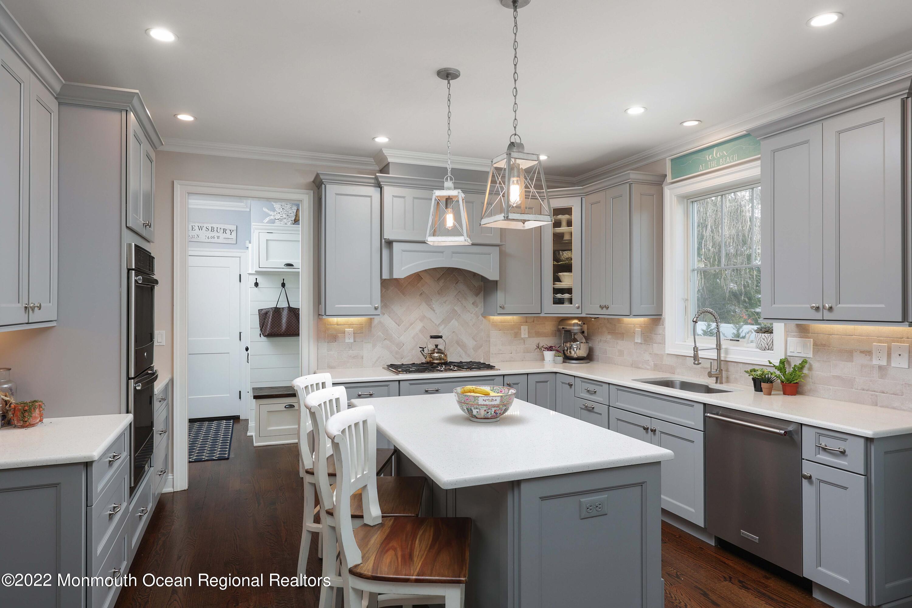 47 Shadowbrook Road Shrewsbury, NJ 07702 - Photo 15 of 39 a kitchen with a sink a stove a refrigerator and cabinets