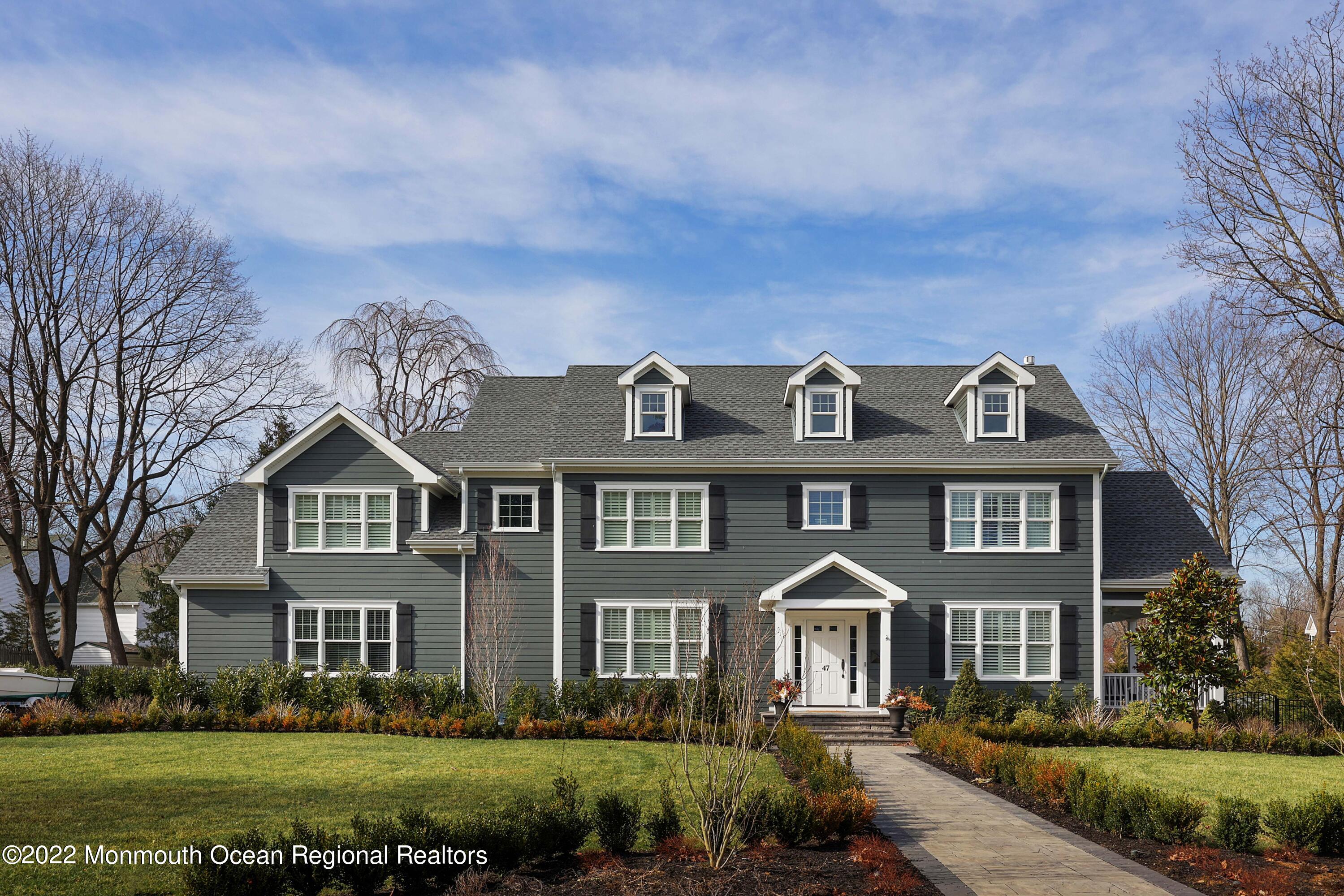 47 Shadowbrook Road Shrewsbury, NJ 07702 - Photo 2 of 39 a front view of a house with a yard