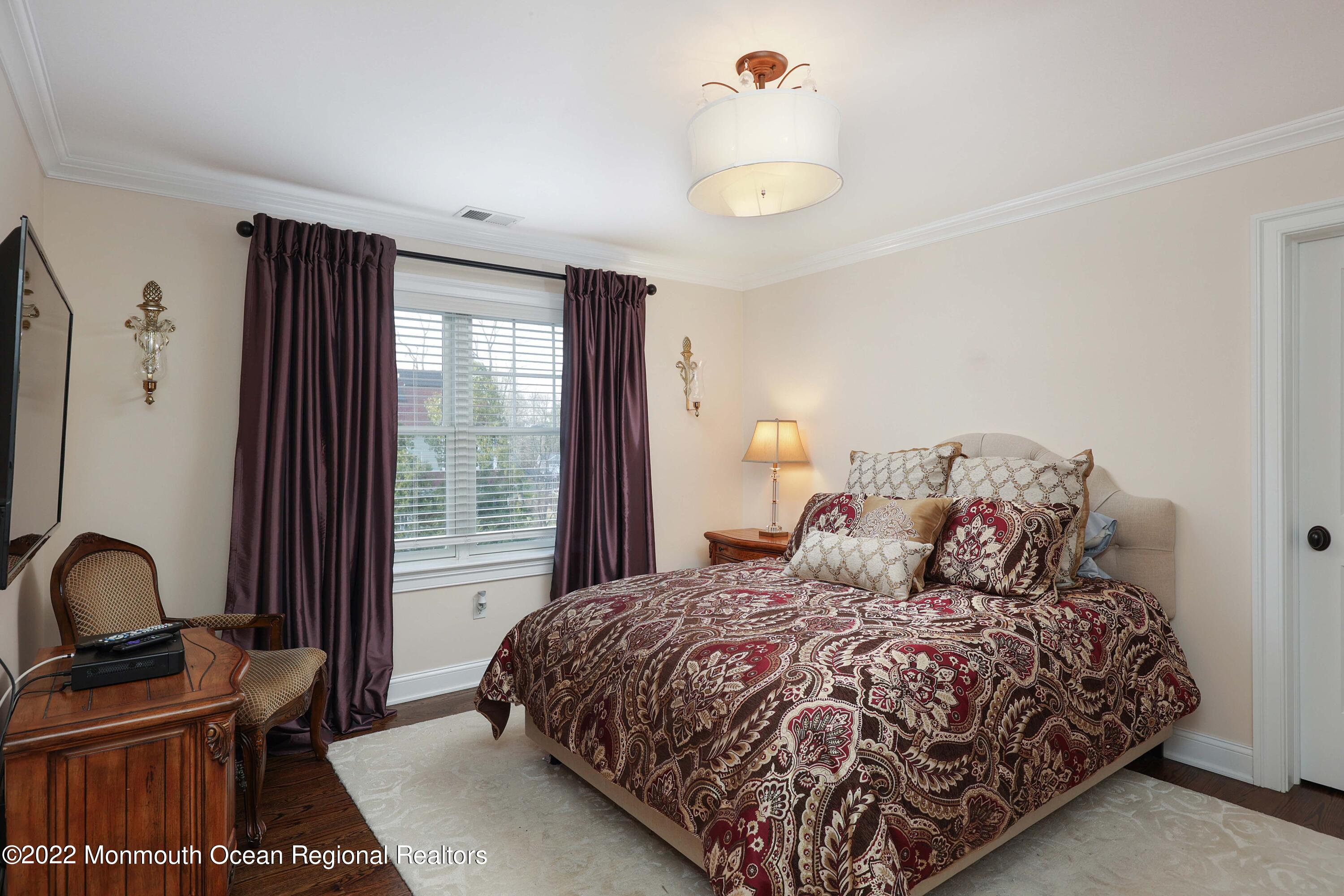 47 Shadowbrook Road Shrewsbury, NJ 07702 - Photo 22 of 39 a bedroom with a bed and a window