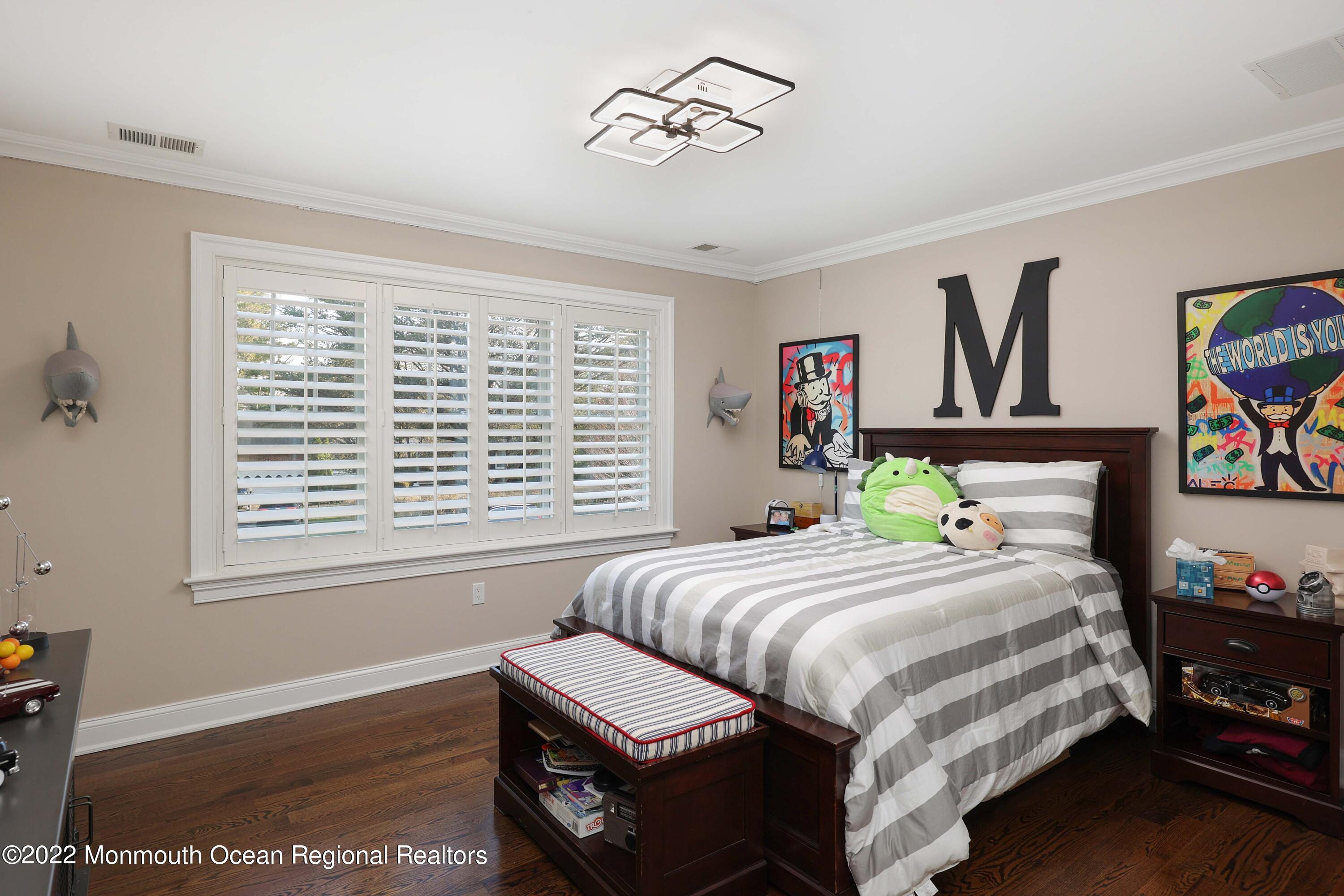 47 Shadowbrook Road Shrewsbury, NJ 07702 - Photo 23 of 39 a bedroom with a bed wooden floor and window