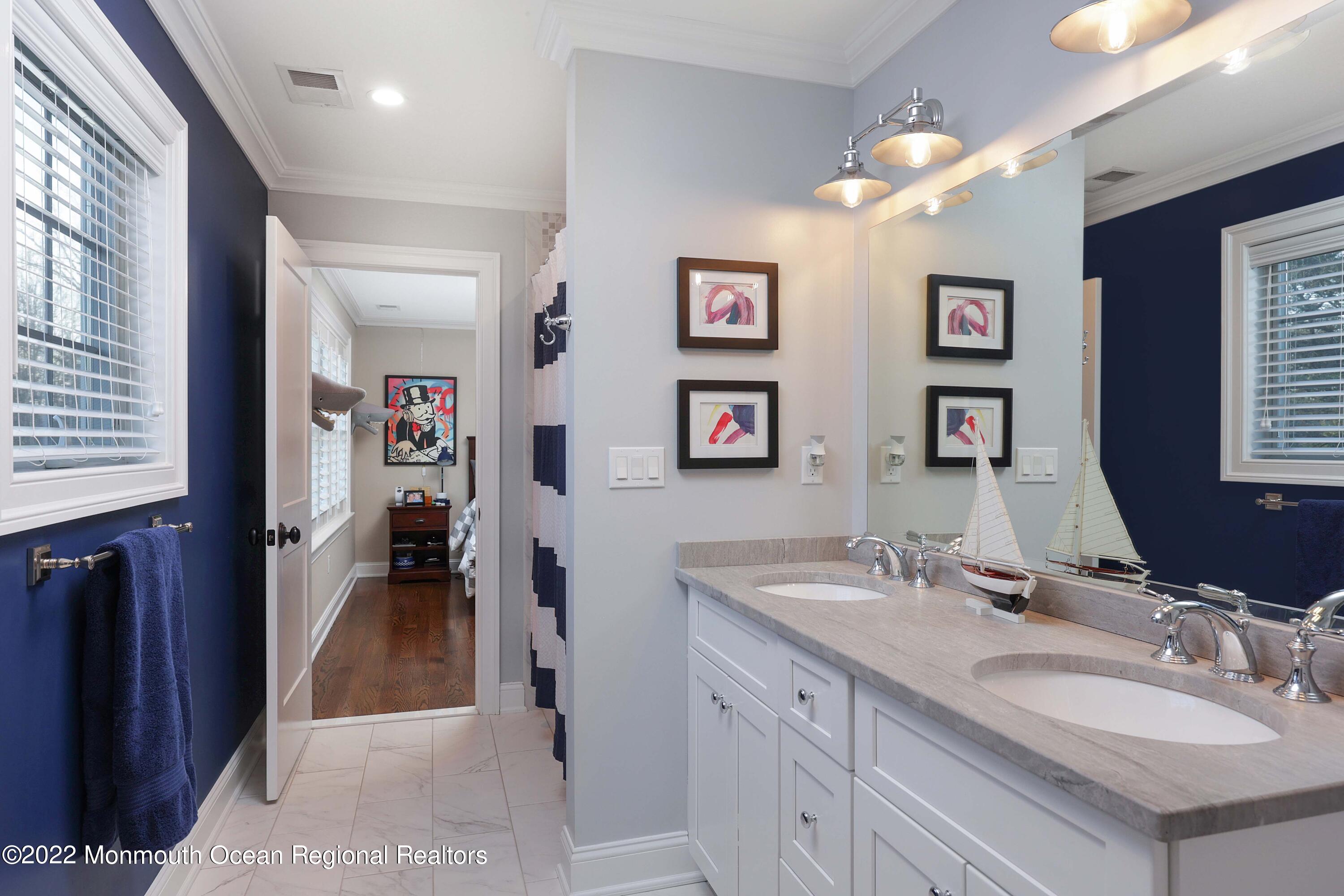 47 Shadowbrook Road Shrewsbury, NJ 07702 - Photo 24 of 39 a en suite bathroom with a double vanity sink and a mirror