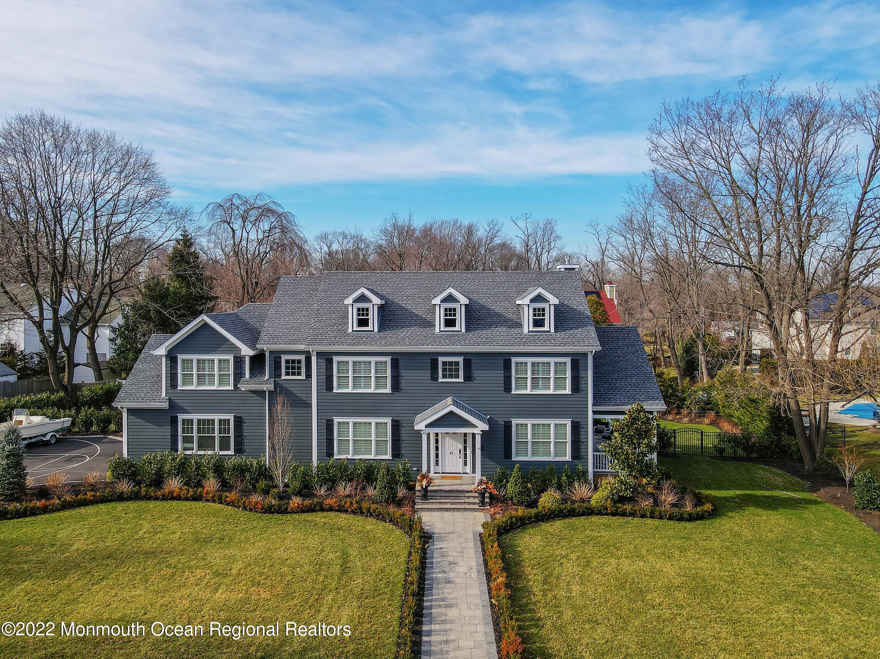 47 Shadowbrook Road Shrewsbury, NJ 07702 - Photo 3 of 39 a front view of a house with yard and green space