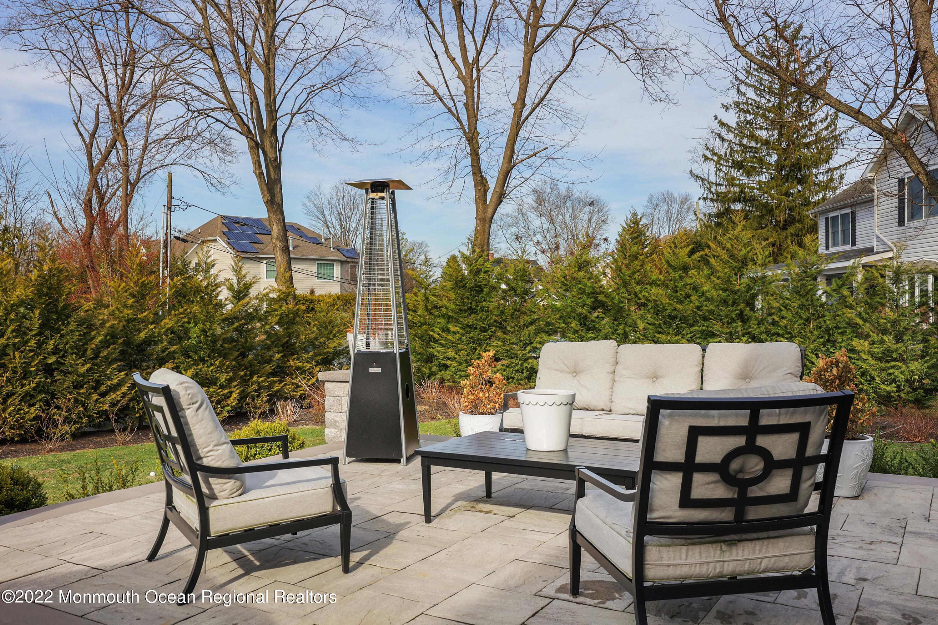 47 Shadowbrook Road Shrewsbury, NJ 07702 - Photo 32 of 39 a view of a patio with a table and chairs