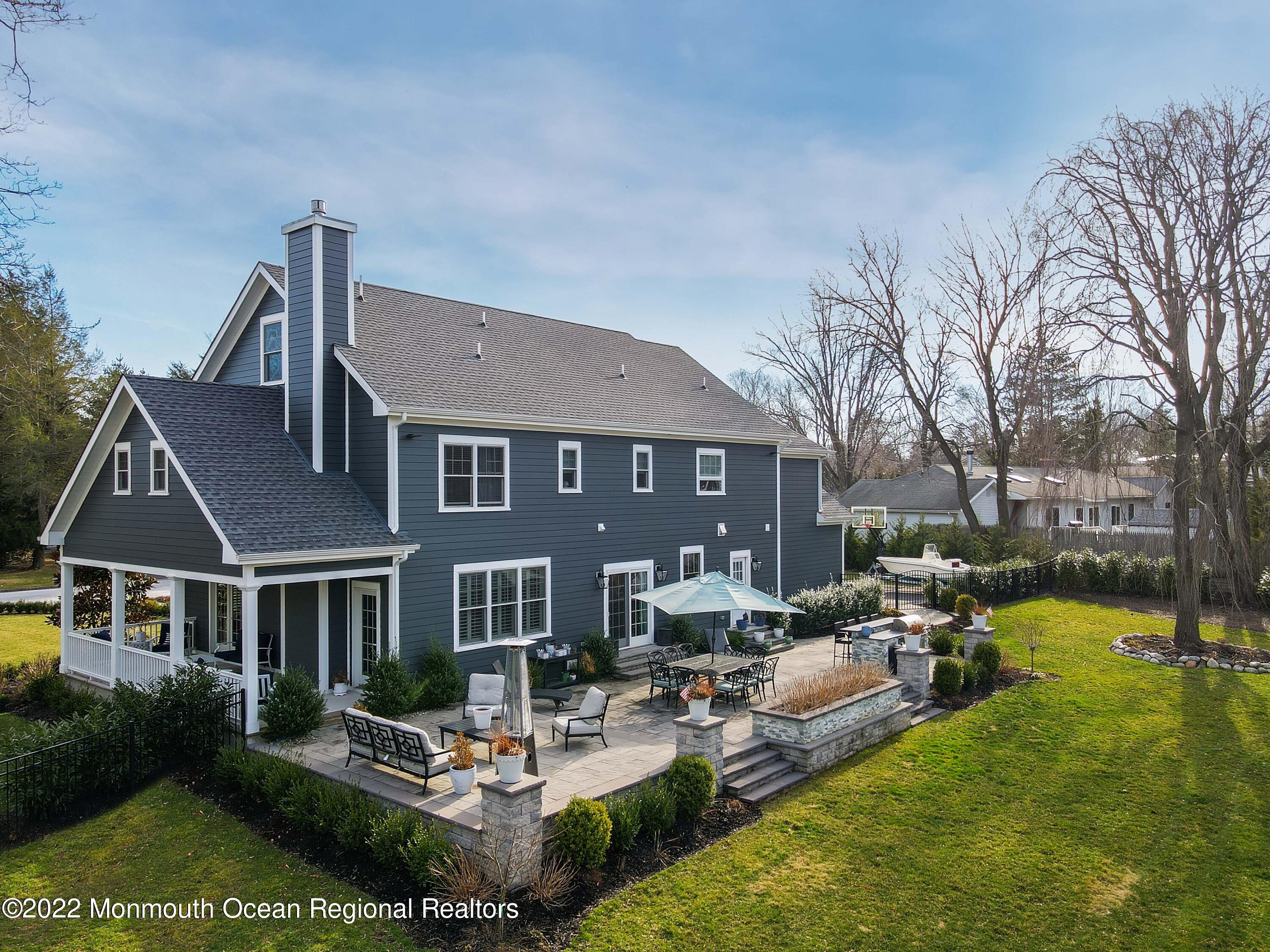 47 Shadowbrook Road Shrewsbury, NJ 07702 - Photo 36 of 39 a front view of a house with swimming pool garden and patio